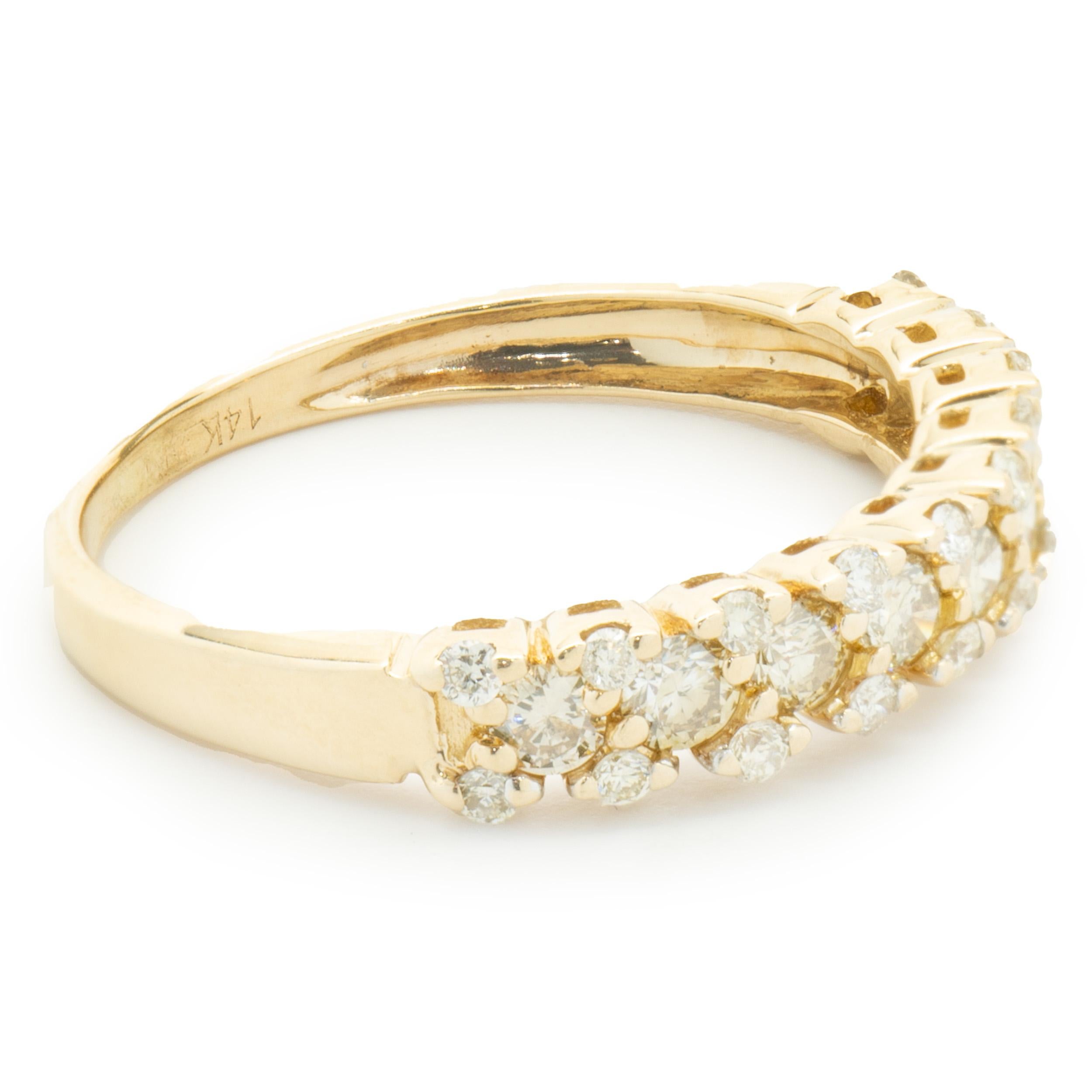 Designer: custom
Material: 14k yellow gold
Diamonds: 9 round cut = .27cttw
Color: Champagne
Diamonds: 20 round cut = .20cttw
Color: H
Clarity: SI1
Size: 5.75 (please allow two additional shipping days for sizing requests)  
Dimensions: ring measures