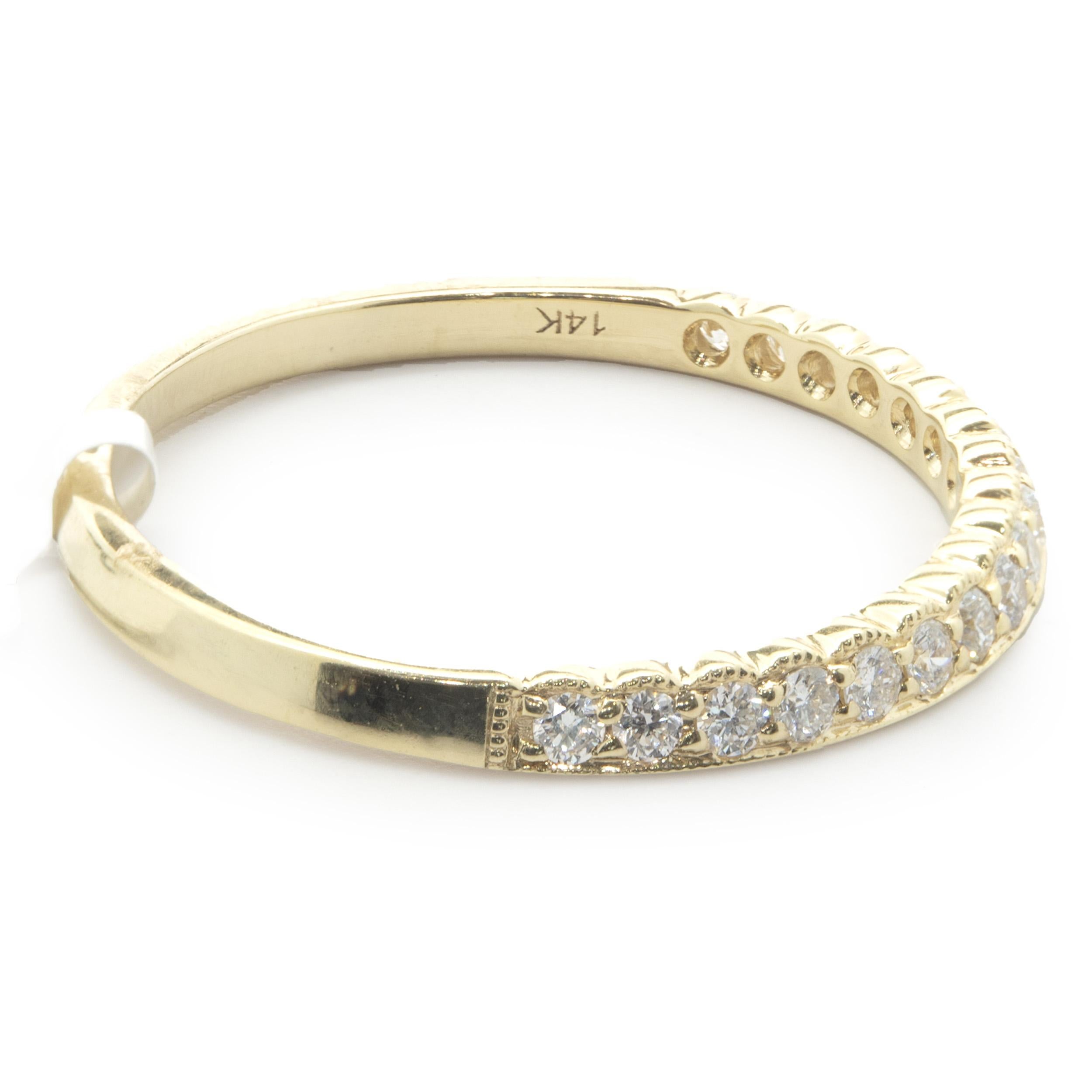 Designer: Custom
Material: 14K yellow gold
Diamond: 17 round brilliant cut = 0.22cttw
Color: G
Clarity: SI1
Size: 6.5 (complimentary sizing available upon request)
Weight: 1.39 grams