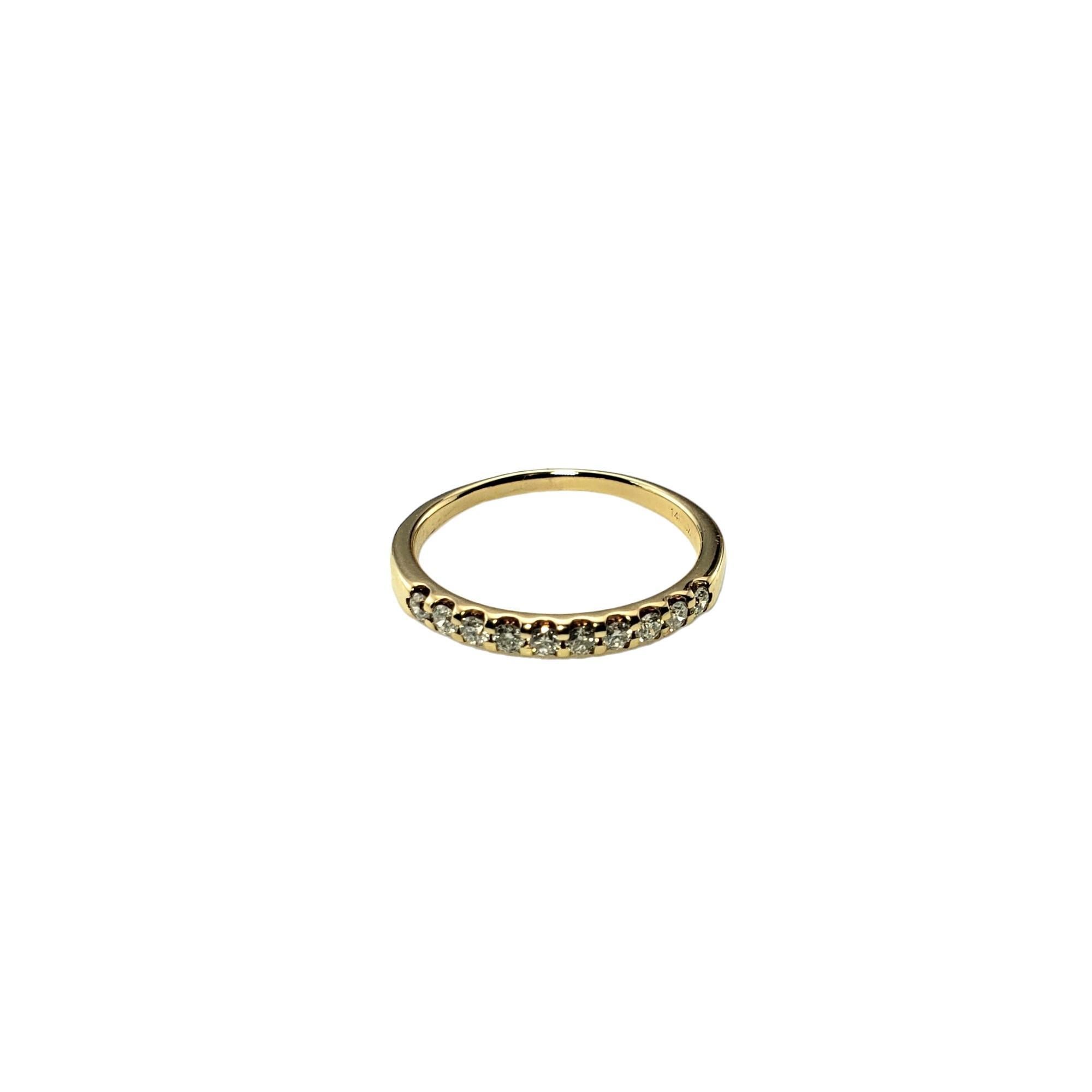 Vintage 14 Karat Yellow Gold Diamond Band Ring Size 6.5-

This sparkling band features ten round brilliant cut diamonds set in classic 14K yellow gold.  Width:  2 mm.  Shank: 1.6 mm.

Total diamond weight: .30 ct.

Diamond clarity: SI1-I1

Diamond