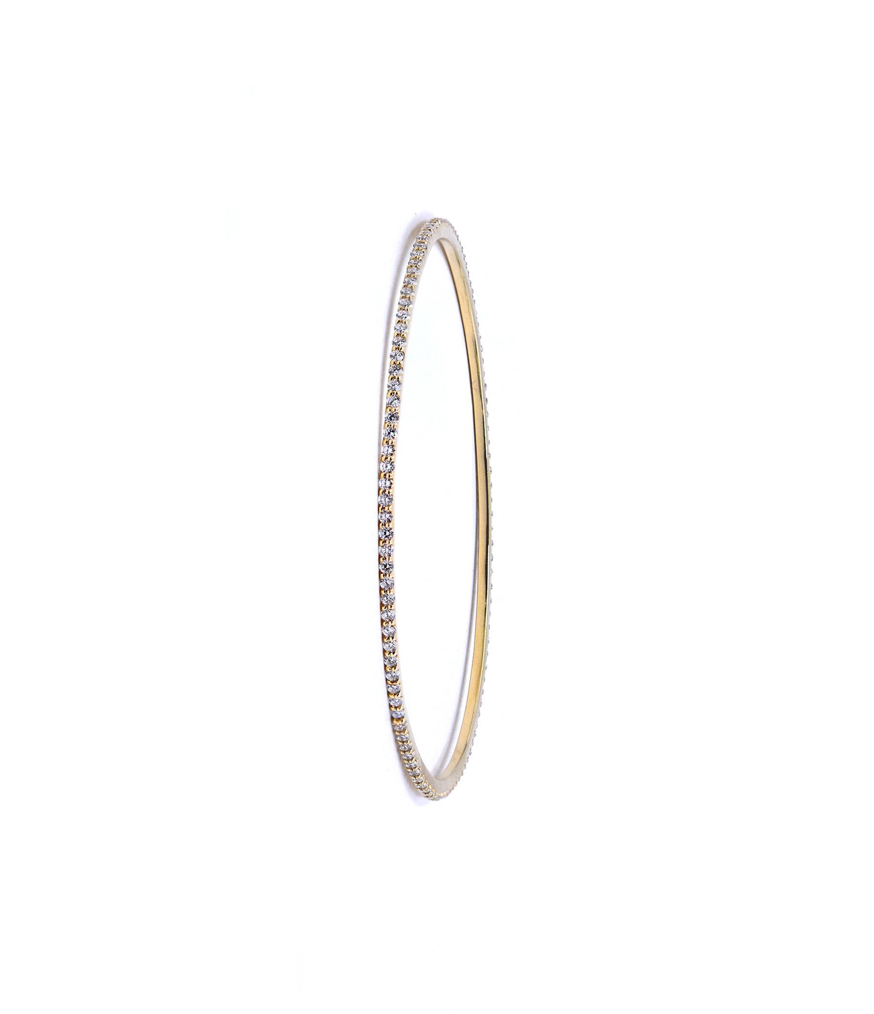 Designer: custom designed 
Material: 14K yellow gold
Diamonds: 90 round brilliant cut = 1.80cttw
Color: G
Clarity: VS1
Dimensions: bracelet will fit a 8-inch wrist 
Weight: 7.79 grams
