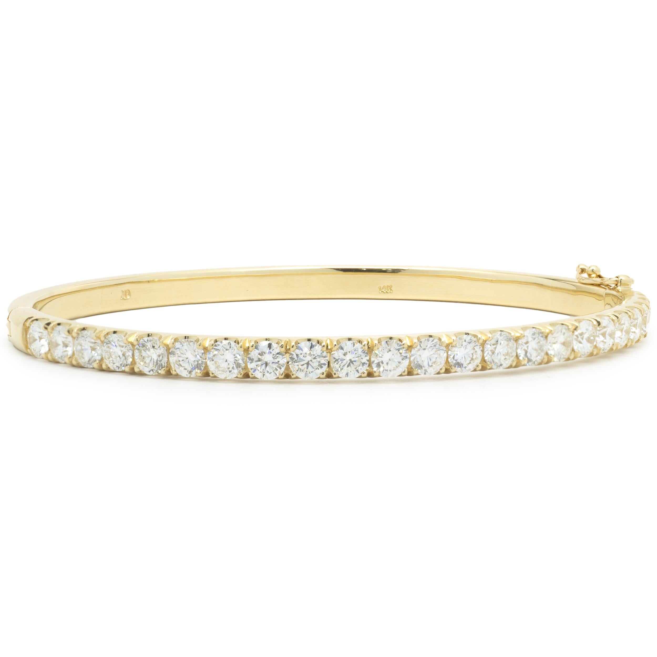 Designer: custom
Material: 14K yellow gold
Diamonds: 23 round brilliant cut = 3.82cttw
Color: H
Clarity: VS2
Dimensions: bracelet will fit up to a 7-inch wrist
Weight: 20.30 grams
