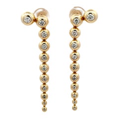 Orecchini a goccia con diamante incastonato in oro giallo 14 carati 1,02 carati