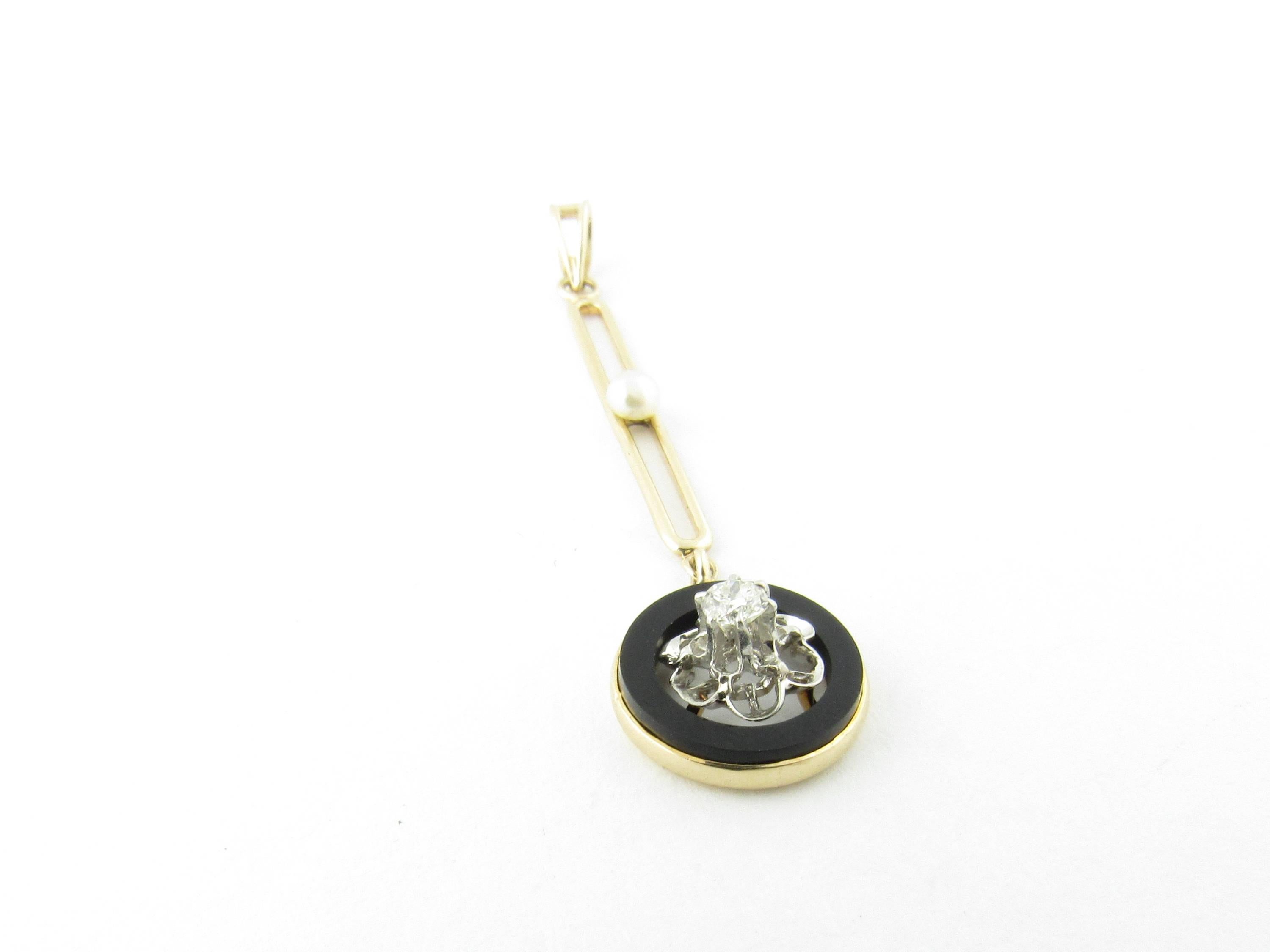 Vintage 14 Karat Yellow Gold Black Onyx, Diamond and Pearl Pendant

This exquisite pendant features one round brilliant cut diamond detailed with black onyx and one lovely seed pearl. Set in 14K yellow gold.

Approximate total diamond weight: .06