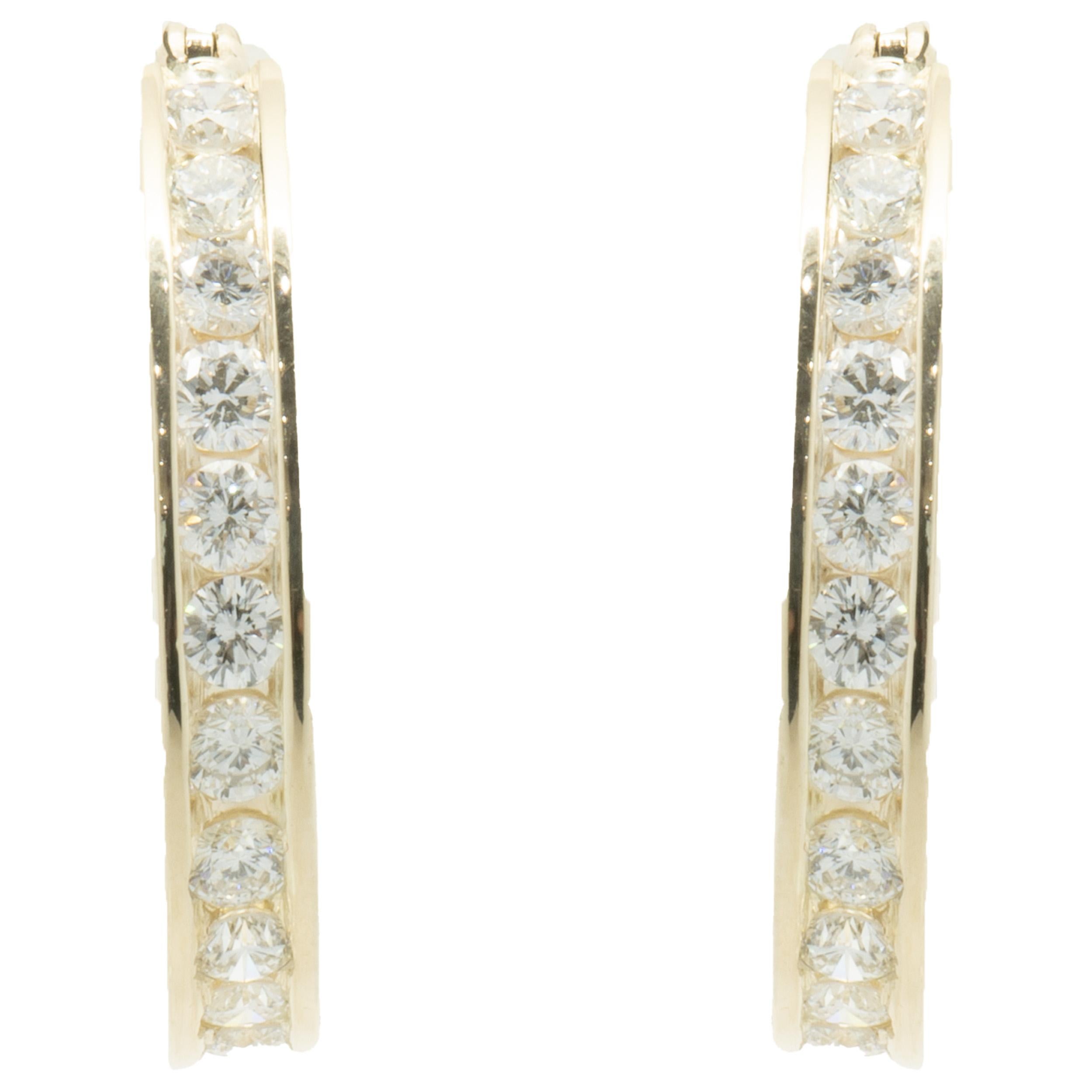 Designer: Custom
Material: 14K yellow gold
Diamond: 24 round brilliant cut = 1.95cttw
Color: G
Clarity SI1-2
Dimensions: earrings measure 25mm long
Weight: 7.85 grams
