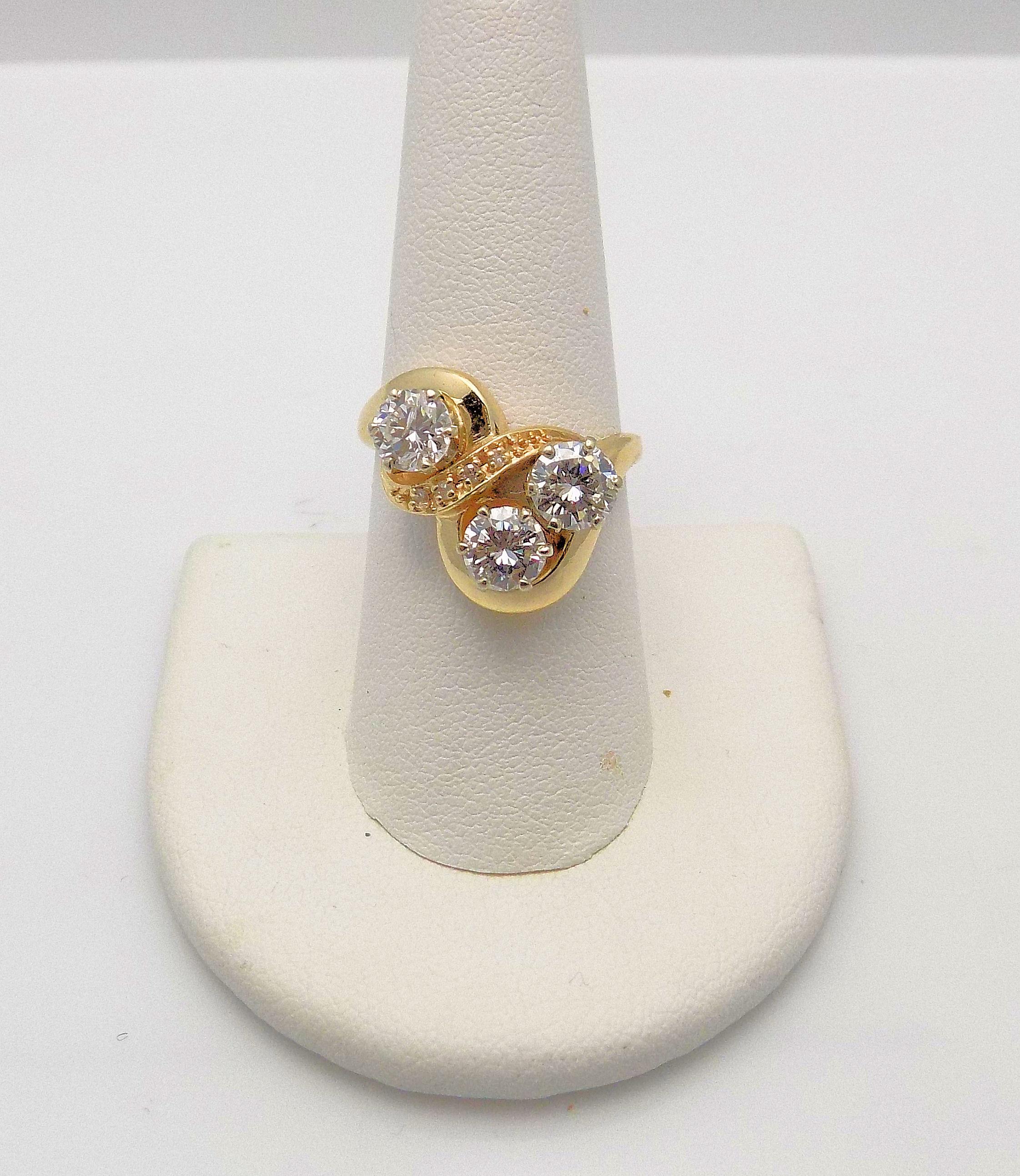 Fabulous 14 Karat Yellow Gold Swirl Motif Ring Featuring 3 Round Brilliant Diamonds 1.75 Carat Total Weight, 4 Single Cut Diamonds 0.05 Carat Total Weight, S1-I1, H-I; Ring Size/Finger Size 8.5; 3.5 DWT or 5.44 Grams.