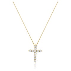 Collier croix en or jaune 14 carats et diamants