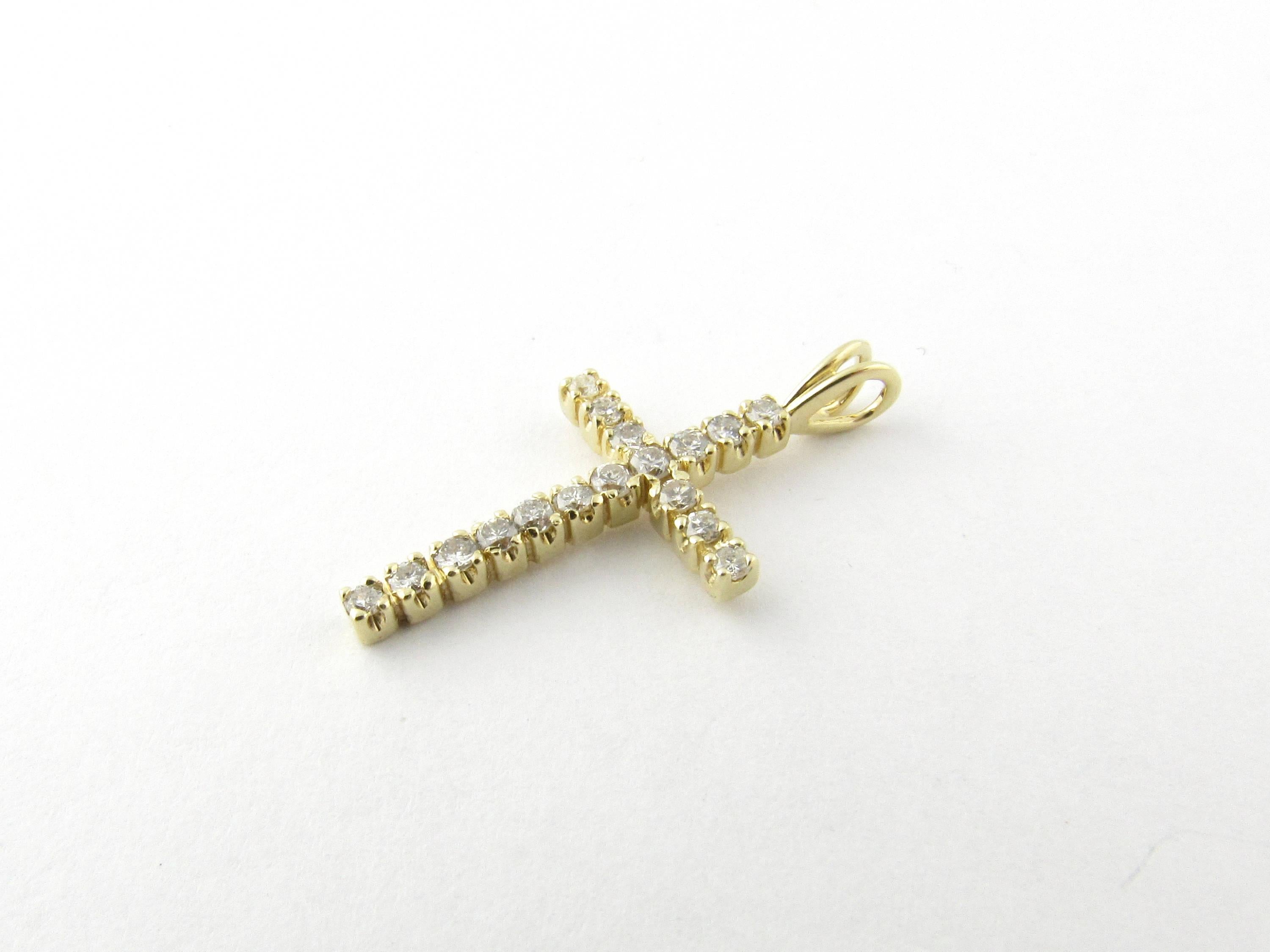 Vintage 14 Karat Yellow Gold Diamond Cross Pendant

This sparkling cross pendant features 17 round brilliant cut diamonds set in classic 14K yellow gold.

Approximate total diamond weight: .34 ct.

Diamond clarity: SI1-I1

Diamond color: H-I

Size: 