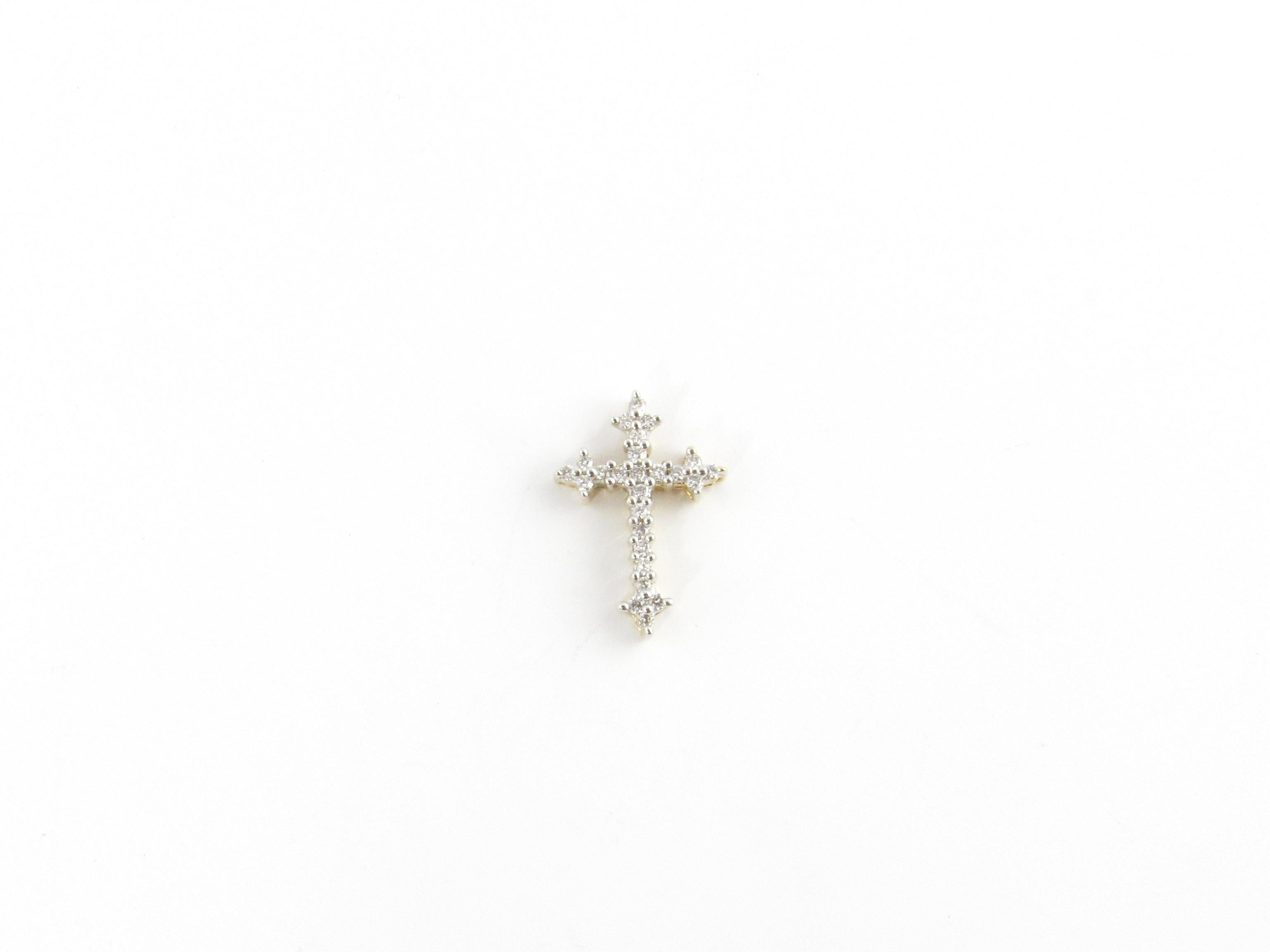 Vintage 14 Karat Yellow Gold Diamond Cross Pendant

This sparkling cross pendant features 25 round brilliant cut diamonds set in classic 14K yellow gold.

Approximate total diamond weight: .25 ct.

Diamond color: H

Diamond clarity: SI1

Size: 20 mm
