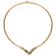 14 Karat Yellow Gold Diamond Emerald Omega Necklace