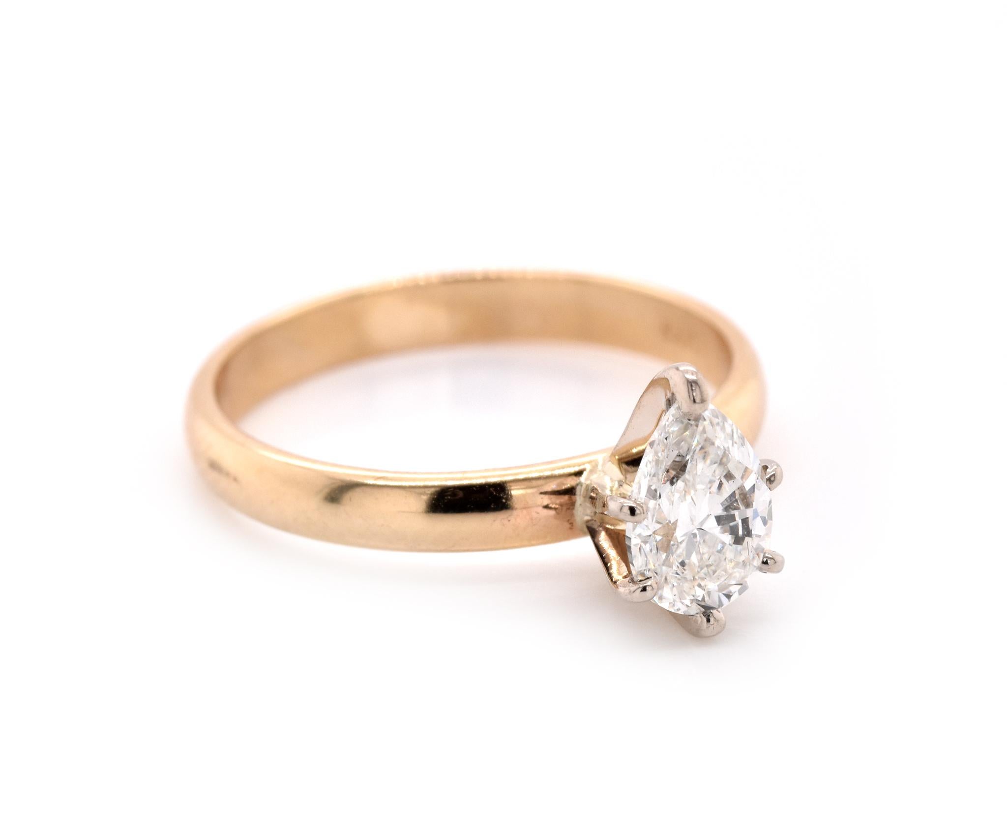 Material: 14k yellow gold
Center Diamond: 1 pear cut = .71ct
Color: H
Clarity: VS2
Ring Size: 6 (please allow up to 2 additional business days for sizing requests)
Dimensions: Ring measures 2.7mm in diameter 
Weight: 2.38 grams
