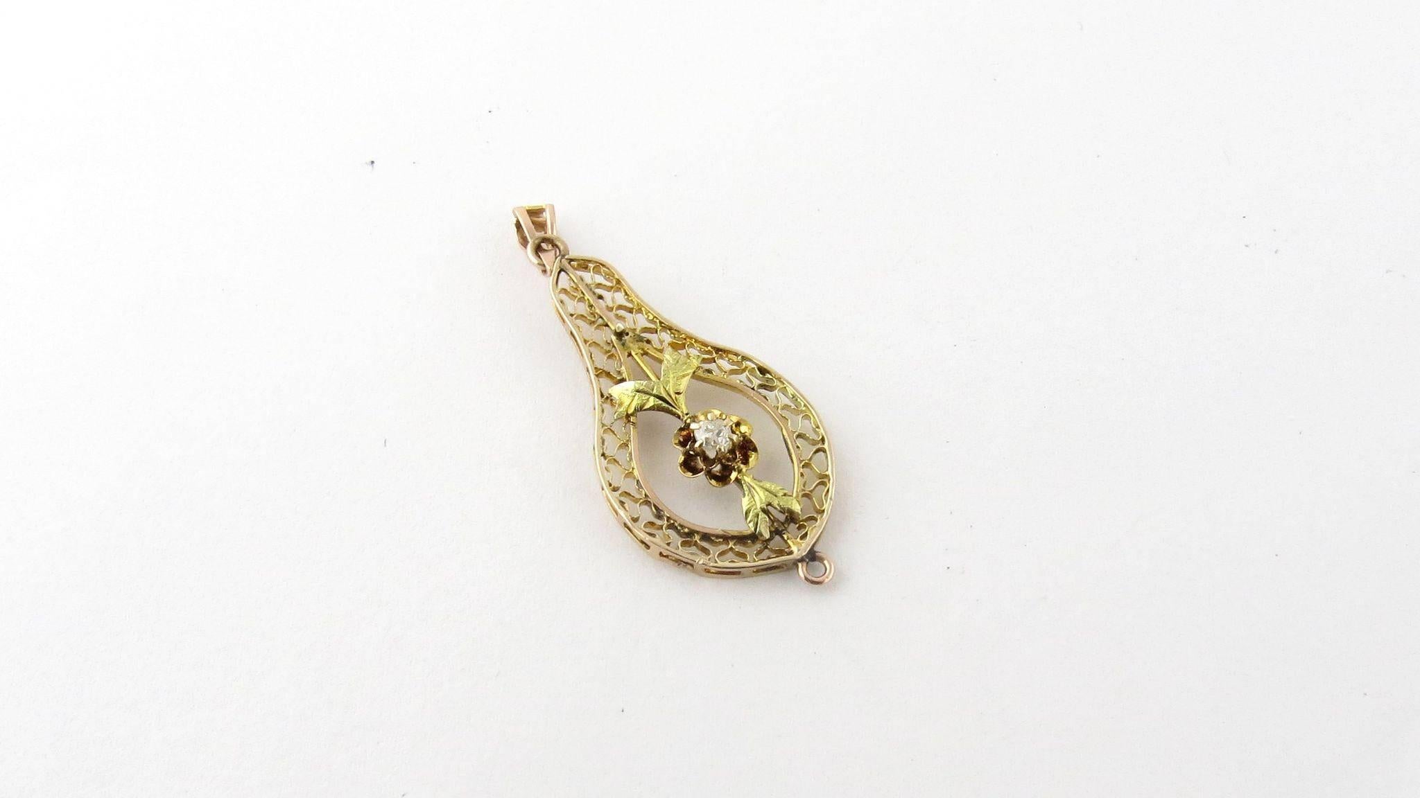 Vintage 14K Yellow Gold Diamond Filagree Pendant

 36 mm in length 14 mm across 

.7 dwt /1.2 g

 .03 old miner diamond in center

 Marked 14K 

Will come shipped priority mail with insurance in a gift box.