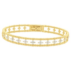 14 Karat Yellow Gold Diamond Floral Station Bangle Bracelet