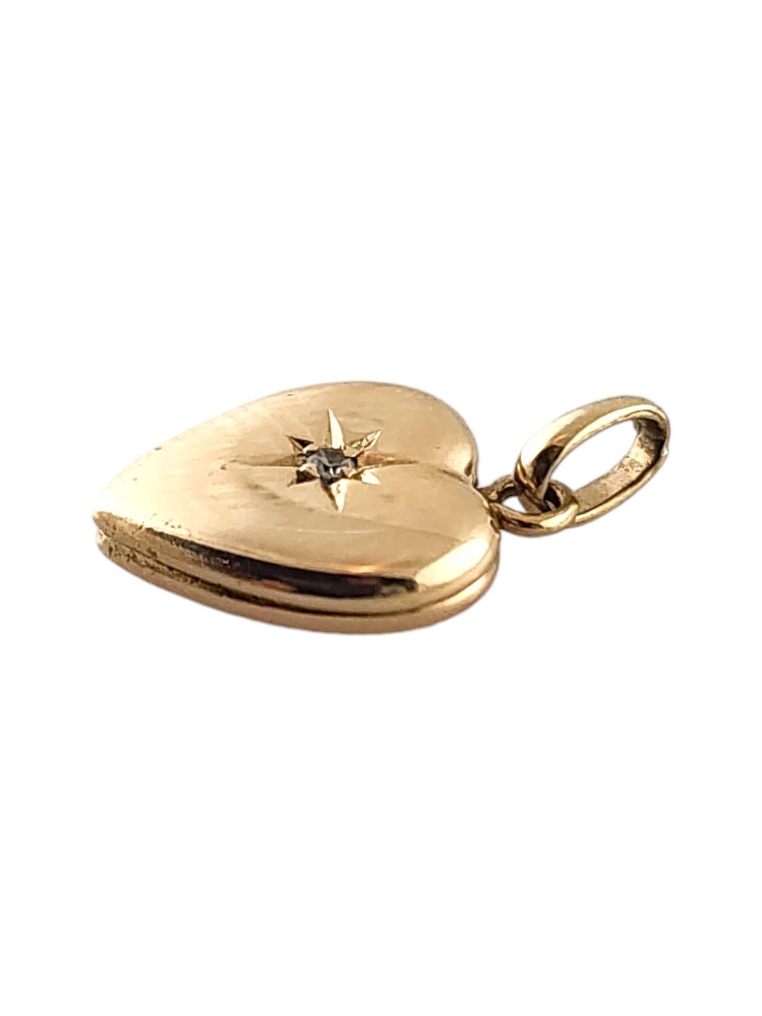 14 Karat Yellow Gold Diamond Heart Locket

This adorable mini heart locket was meticulously crafted from 14K yellow gold with one sparkling single cut diamond in the center!

Approximate total diamond weight: .005 cts

Diamond color: I

Diamond
