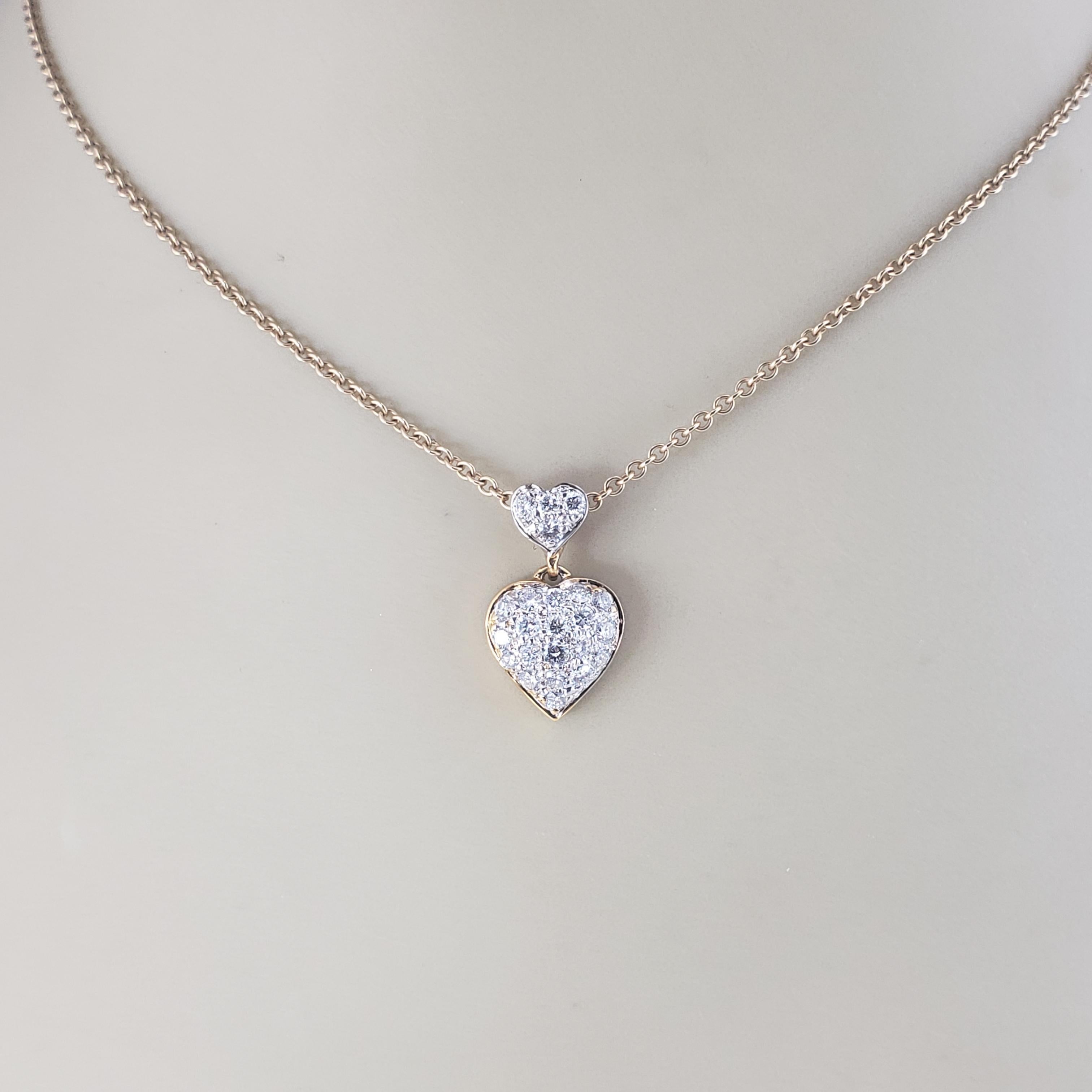 14 Karat Yellow Gold and Diamond Heart Pendant

This sparkling heart pendant features 23 round brilliant cut diamonds set in beautifully detailed 14K yellow gold.

Approximate total diamond weight: .65 ct.

Diamond color: G-I

Diamond clarity: