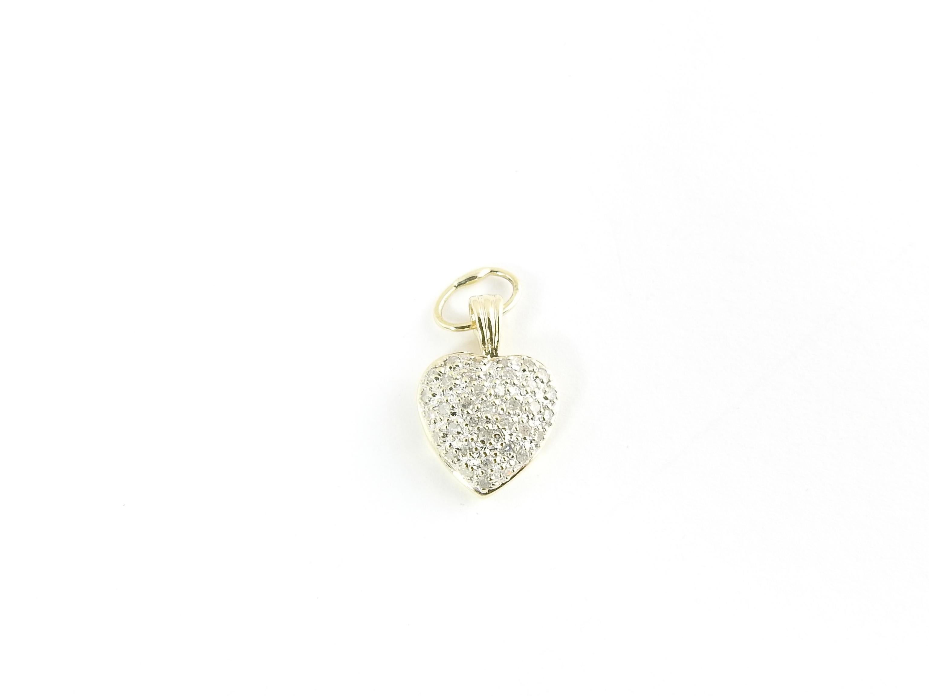 Vintage 14 Karat Yellow Gold Diamond Heart Pendant

This sparkling pendant features 24 round single cut diamonds pave set in classic 14K yellow gold.

Approximate total diamond weight: .24 ct.

Diamond color: J

Diamond clarity: I3

Size: 17 mm x 12