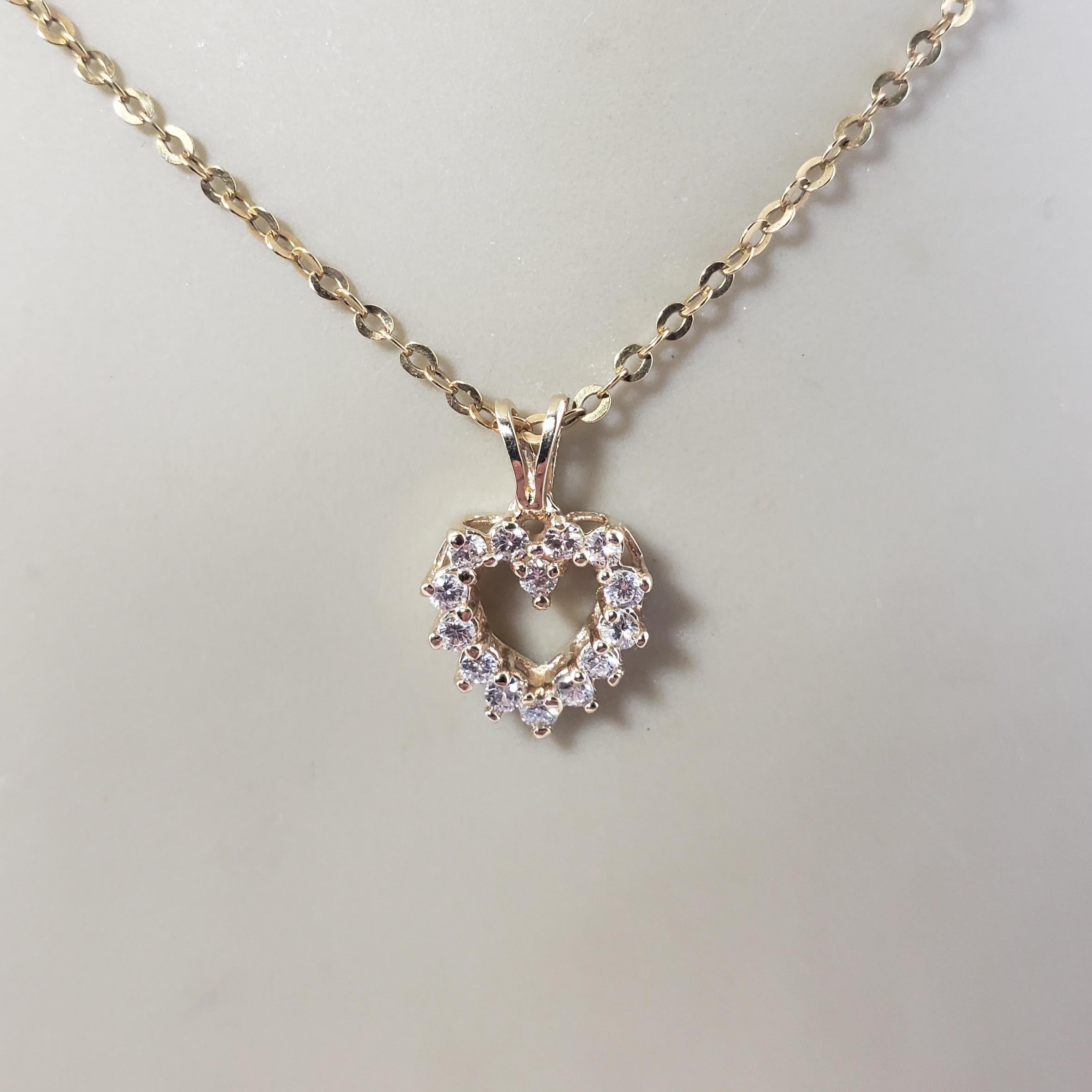 Vintage 14 Karat Yellow Gold Diamond Heart Pendant-

This sparkling heart pendant features 14 round brilliant cut diamonds set in classic 14K yellow gold.

Approximate total diamond weight: .30 ct.

Diamond clarity: SI1-VS2

Diamond color: G

Size: