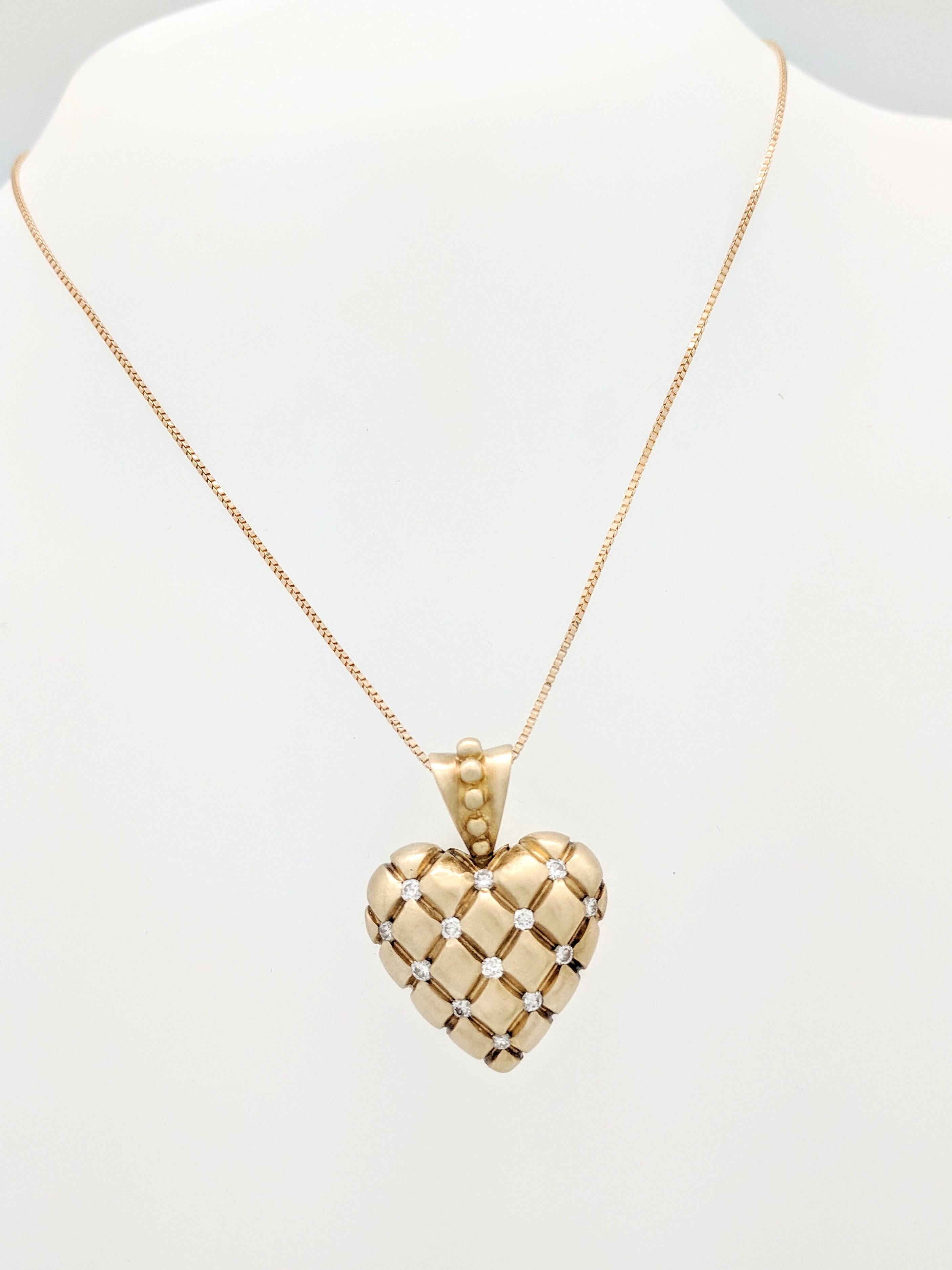 You are viewing a Beautiful Diamond Heart Pendant Necklace. This piece is crafted from 14k yellow gold and weighs 15.4 gram. It features (11) .03ct round brilliant cut diamonds for an estimated .33ctw. The pendant measures 1.25