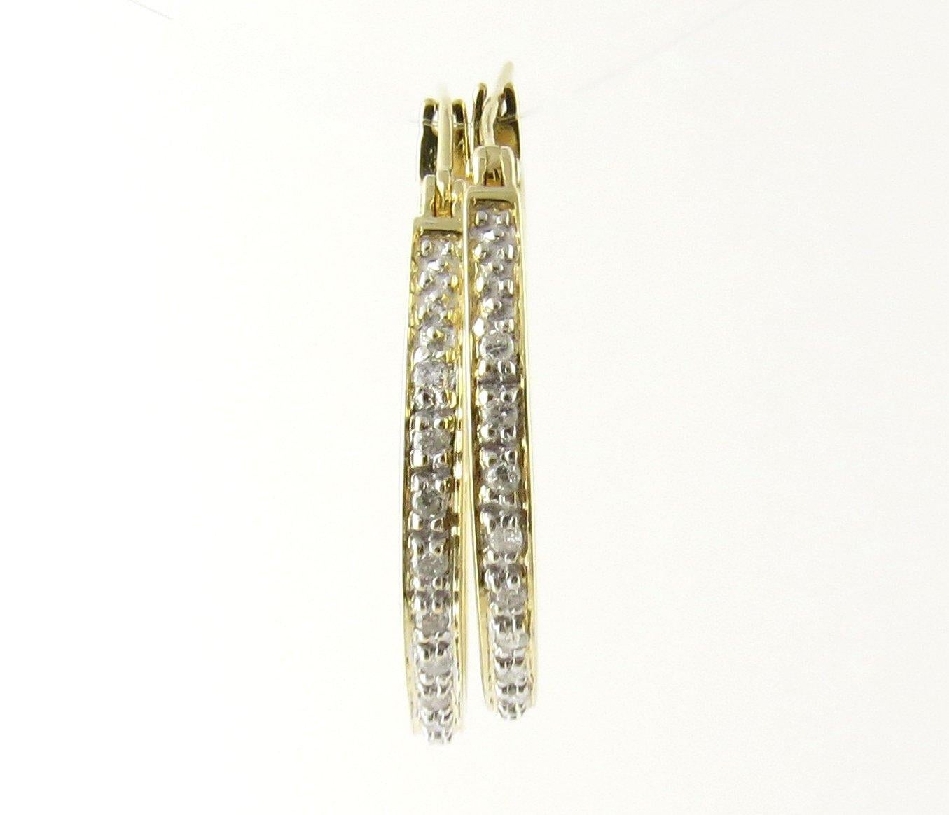 Vintage 14 Karat Yellow Gold and Diamond Hoop Earrings. These sparkling hoop earrings each feature 15 round brilliant cut diamonds set in classic 14K yellow gold.
Approximate total diamond weight: .30 ct. Diamond color: H-I Diamond clarity: SI1-SI2