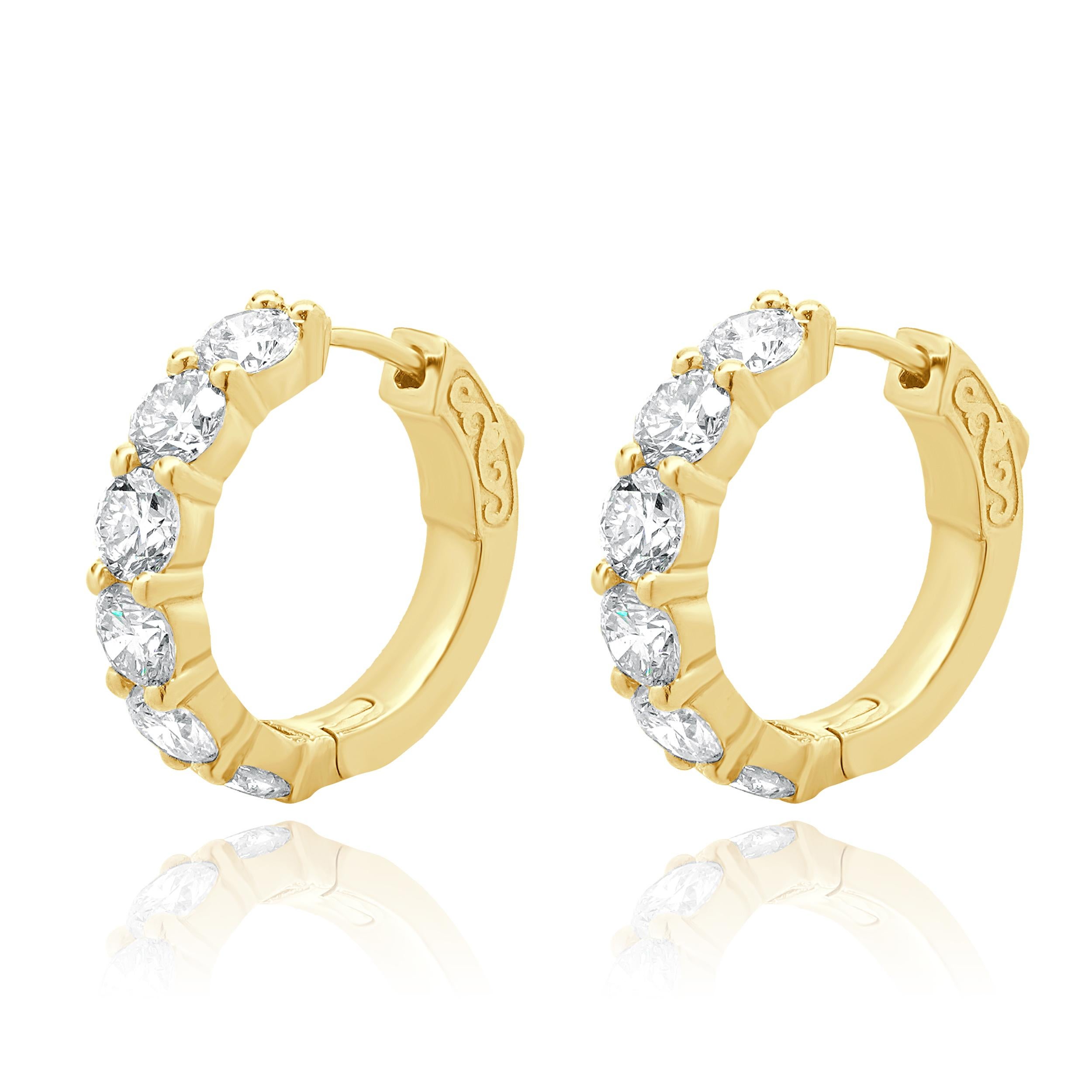 Material: 14K yellow gold
Diamonds: 12 round brilliant cut = 3.49cttw
Color: H
Clarity: SI1
Dimensions: earrings measure approximately 19mm
Fastenings: snap backs
Weight: 5.68 grams
