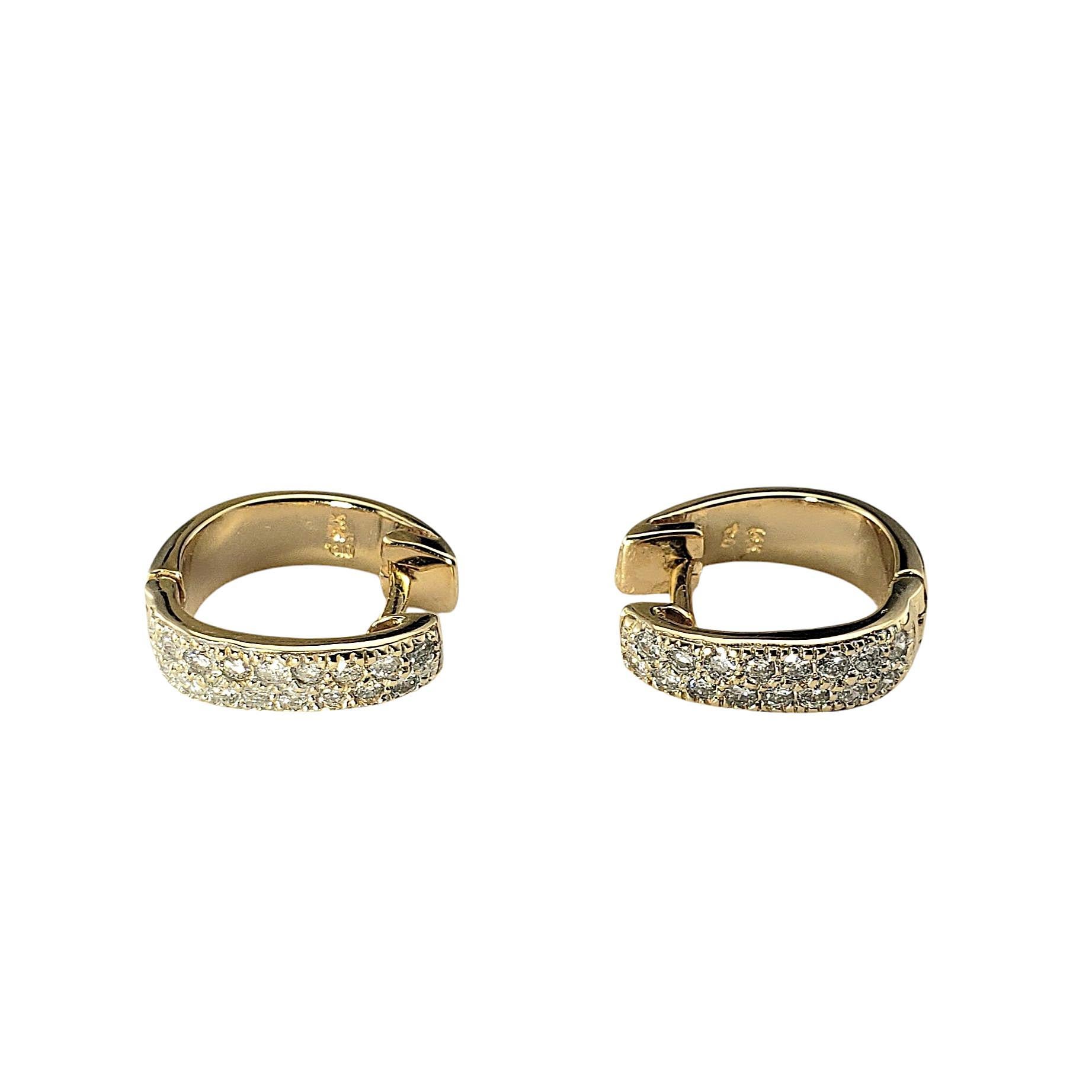 14 Karat Yellow Gold Diamond Huggie Hoop Earrings-

These sparkling huggie hoop earrings each feature 16 round brilliant cut diamonds set in classic 14K yellow gold. Hinged closures.

Approximate total diamond weight: .55-.64 ct.

Diamond color: