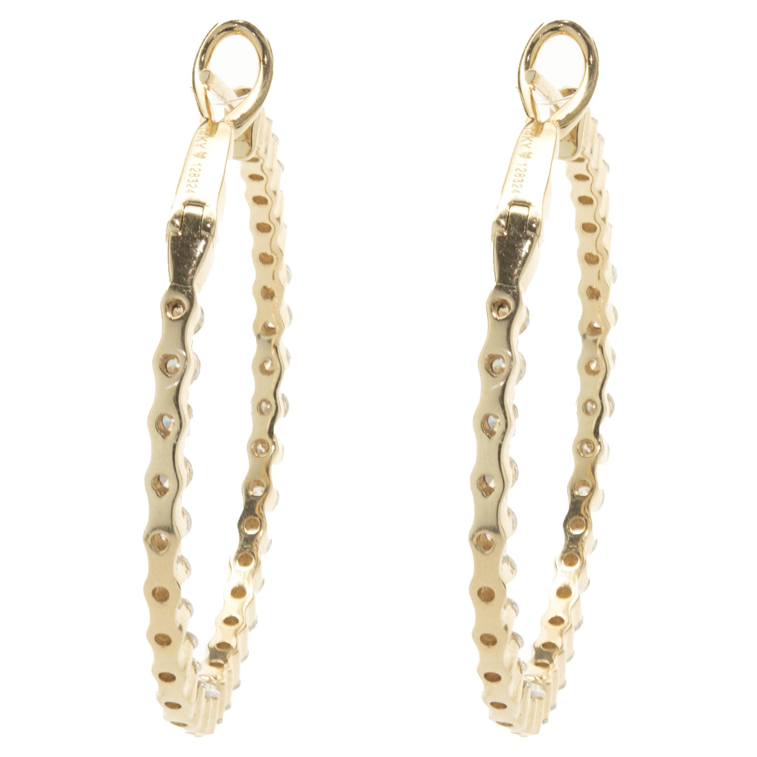 Designer: custom
Material: 14K yellow gold
Diamond: 62 round brilliant = 3.29cttw
Color: G
Clarity: VS1-2
Dimensions: earrings measure 38mm in length
Fastenings: post with omega backs
Weight: 11.31 grams