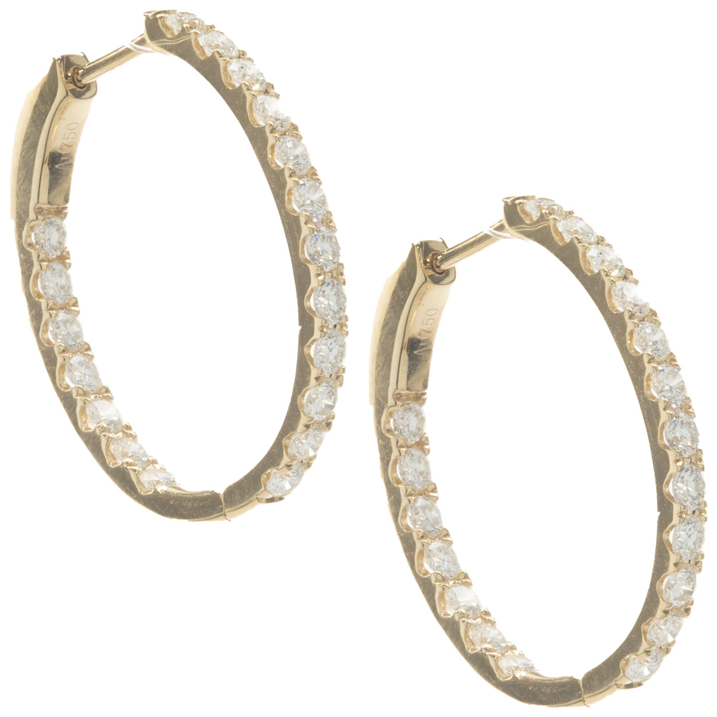 Designer: custom design
Material: 14K yellow gold
Diamonds: 38 round brilliant cut= 1.44cttw
Color: G
Clarity: SI1
Dimensions: earrings measure 23mm long
Weight: 5.74 grams