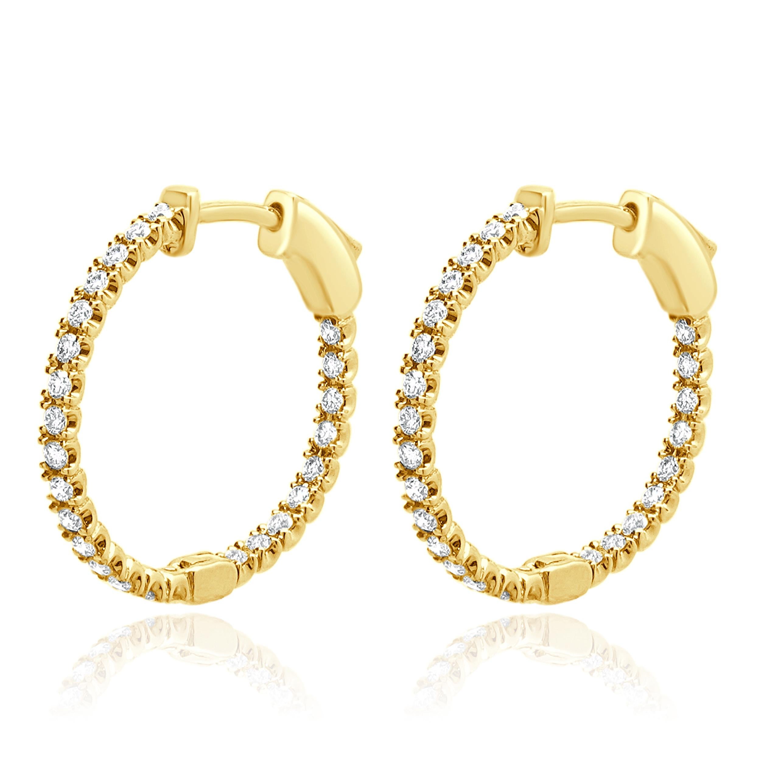 Diseñador: diseño personalizado
Material: oro amarillo de 14 quilates
Diamantes: 50 talla brillante redonda = 0,52ctw
Color: G 
Claridad: SI1
Dimensiones: los pendientes miden 19 mm de largo
Peso: 2.40 gramos

