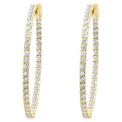 Pendientes de aro con interior y exterior de diamantes en oro amarillo de 14 quilates