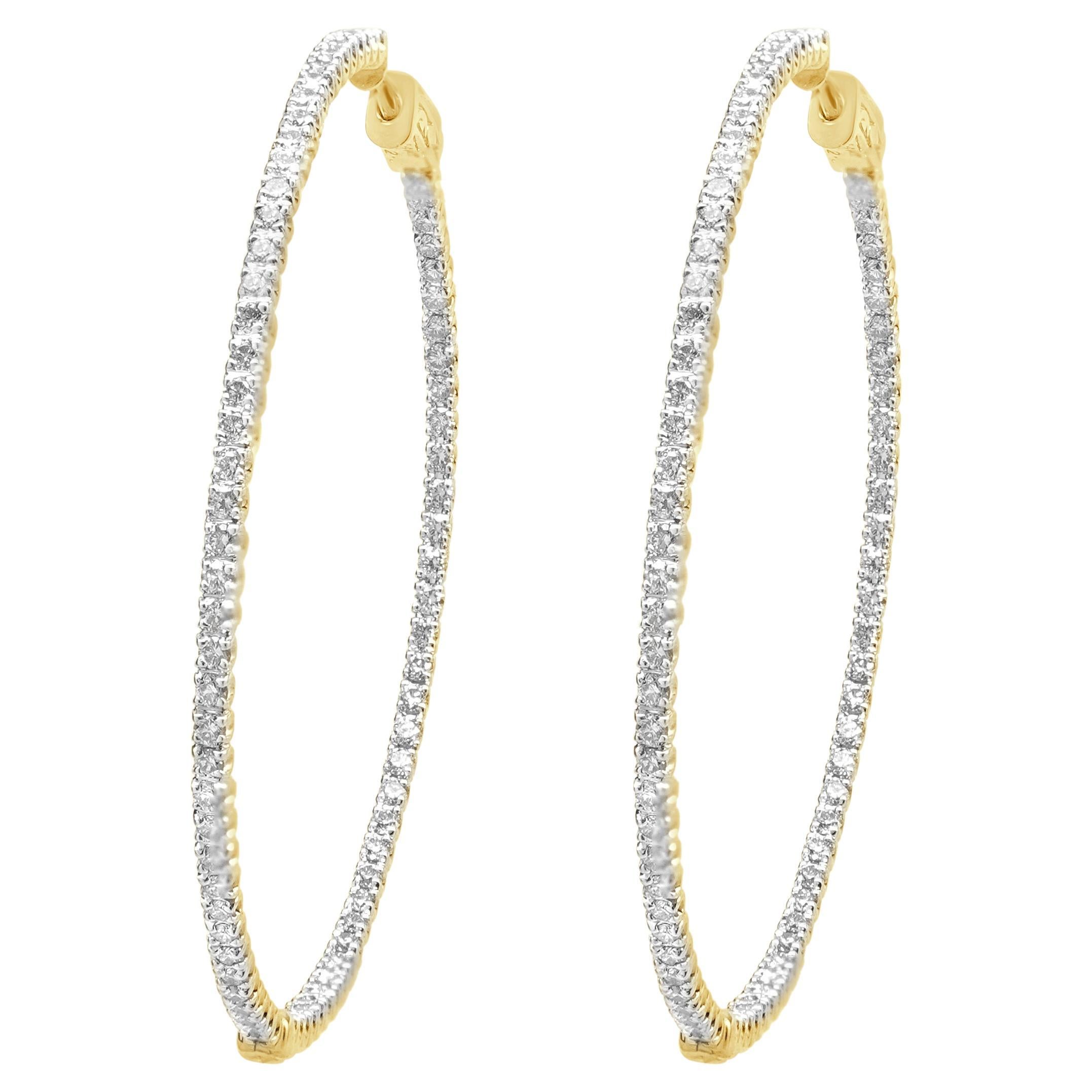 Pendientes de aro con interior y exterior de diamantes en oro amarillo de 14 quilates