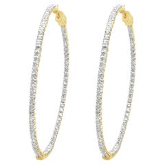 Pendientes de aro con interior y exterior de diamantes en oro amarillo de 14 quilates