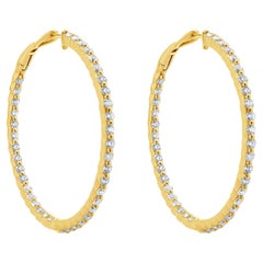 Pendientes de aro con interior y exterior de diamantes en oro amarillo de 14 quilates