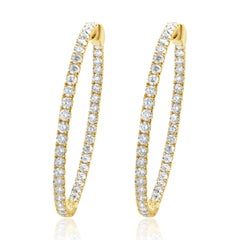 Pendientes de aro con interior y exterior de diamantes en oro amarillo de 14 quilates