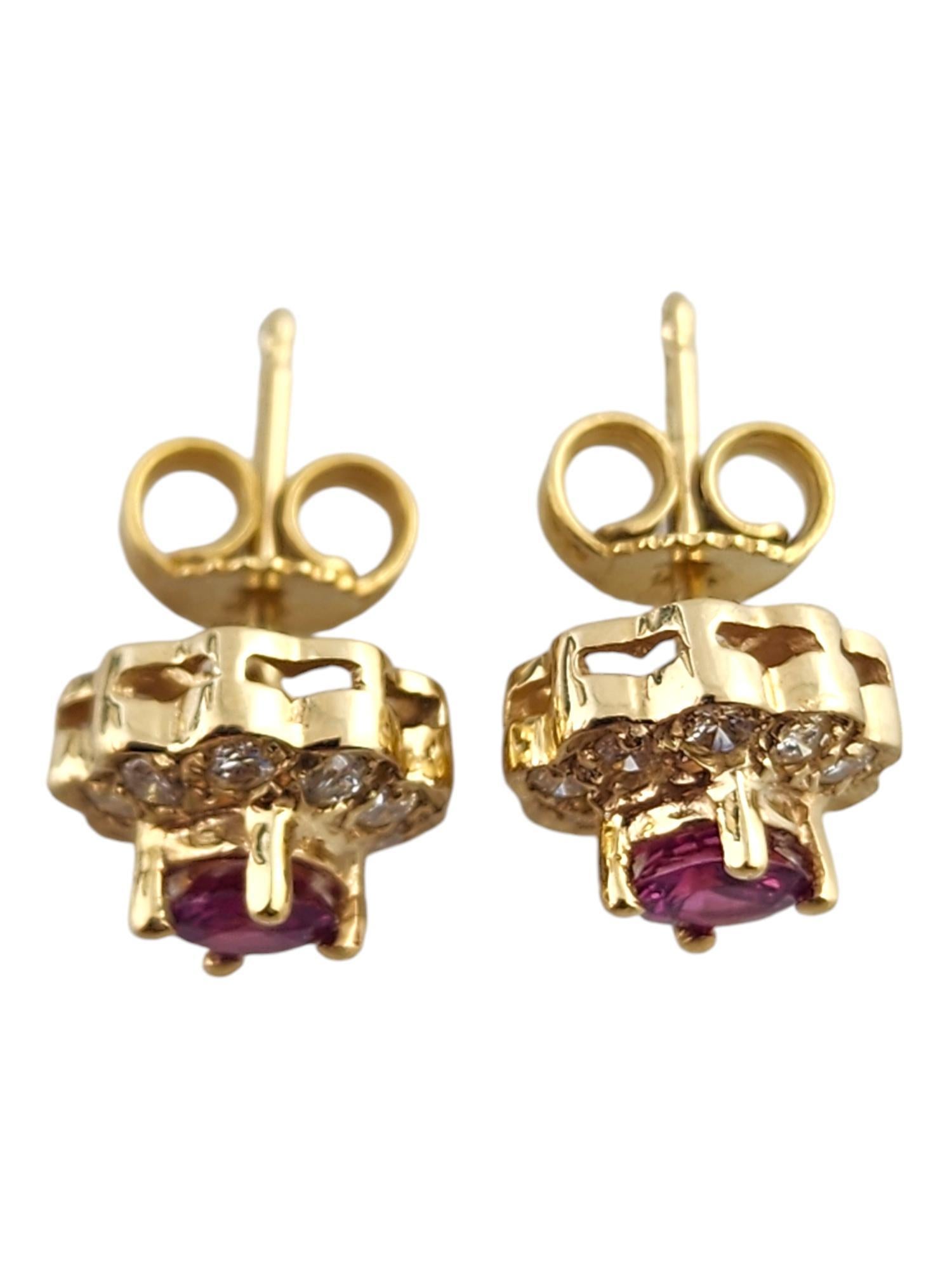 14 Karat Yellow Gold Diamond & Natural Pink Sapphire Halo Stud Earrings

These stunning earrings were meticulously crafted from 14K yellow gold with 2 round natural pink sapphires in the center, surrounded by 18 sparkling round brilliant cut