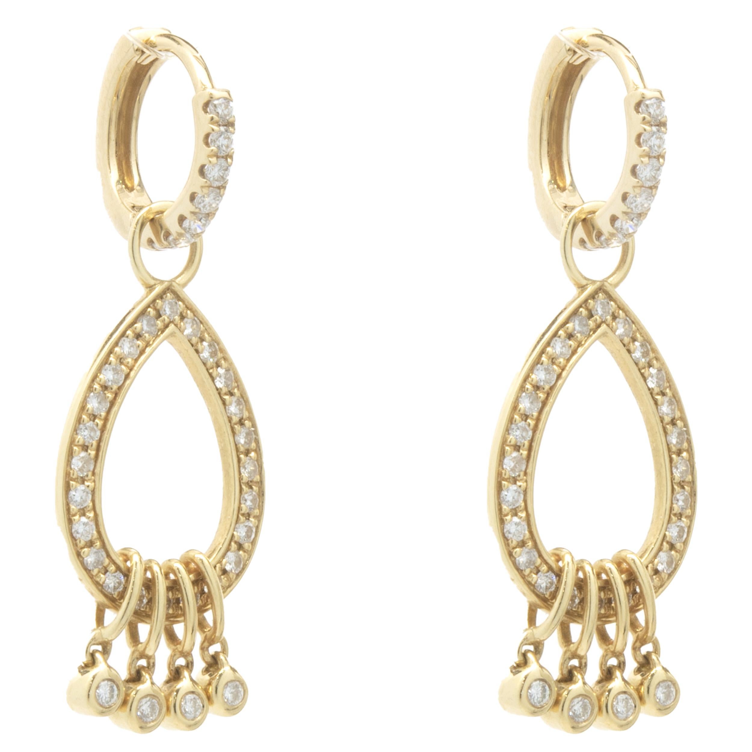 Designer: custom design
Material: 14K yellow gold
Diamonds: 56 round brilliant cut = 0.56cttw
Color: H
Clarity: SI1
Dimensions: earrings measure 23mm
Weight: 2.00 grams