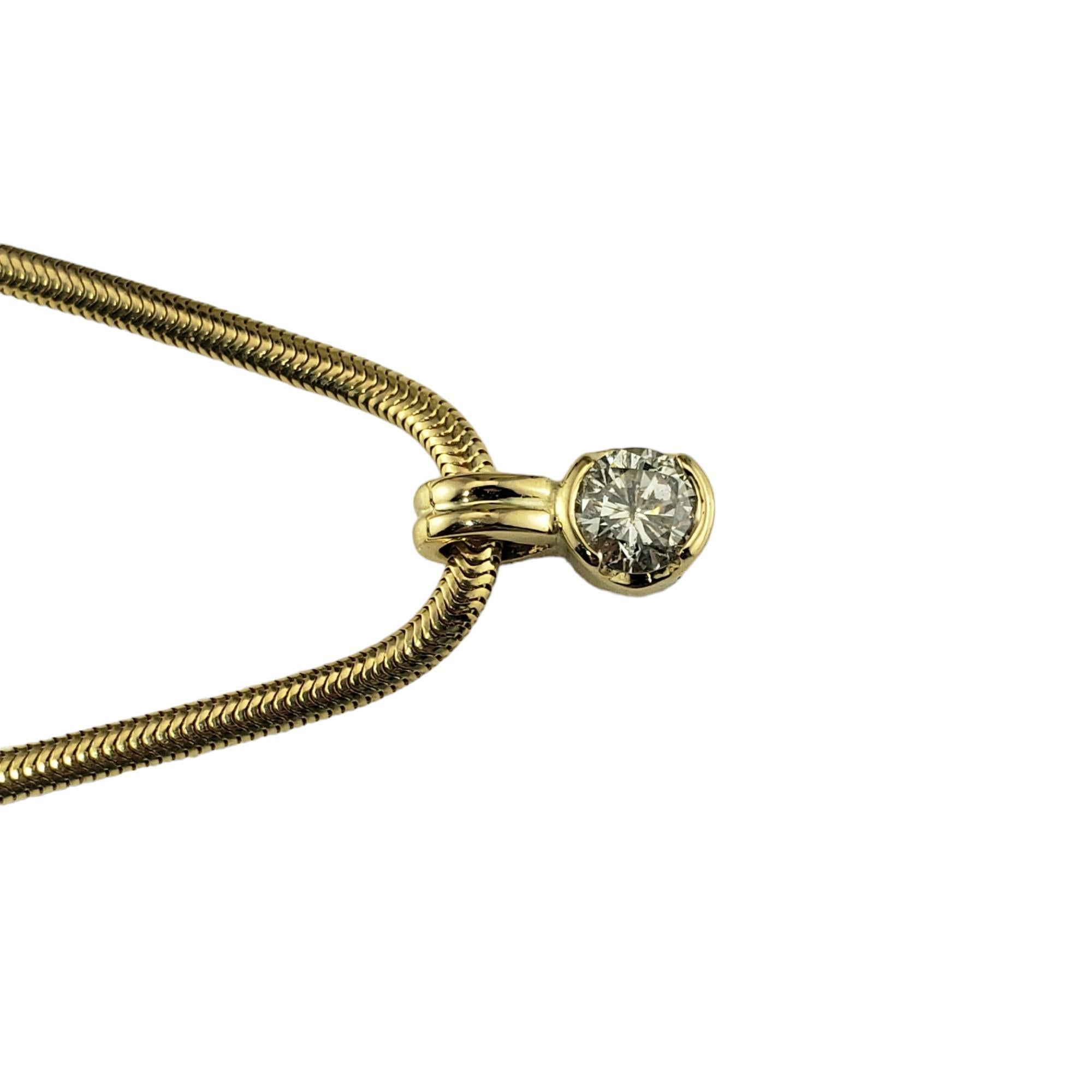 Vintage 14K Yellow Gold Diamond Pendant Necklace-

This lovely pendant features one round brilliant cut diamond set in a classic snake chain necklace.

Approximate total diamond weight: .50 ct.

Diamond color: I

Diamond clarity: I2

Size:  11.5 mm