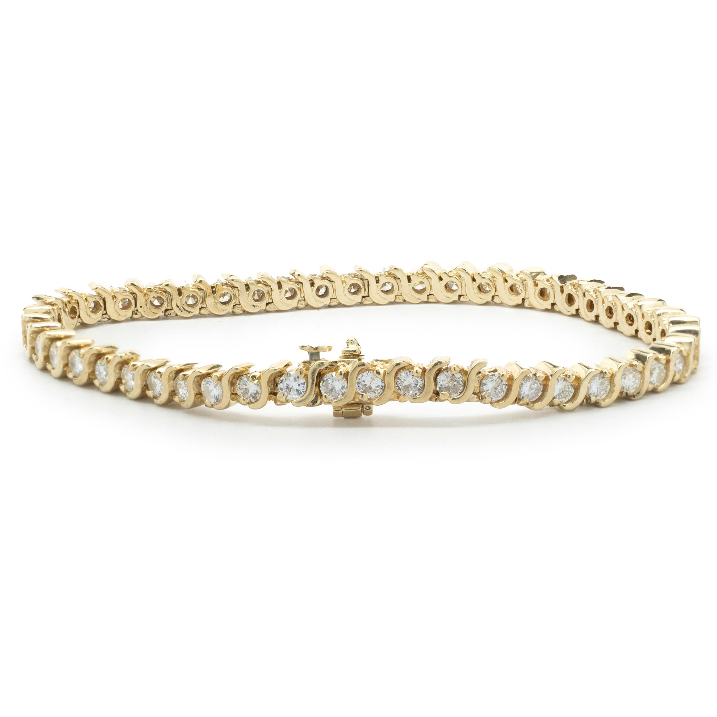 Designer: custom
Material: 14K yellow gold
Diamond: 48 round brilliant= 3.36cttw
Color: H
Clarity: SI1
Dimensions: bracelet will fit up to a 6.5-inch wrist
Weight: 15.15 grams
