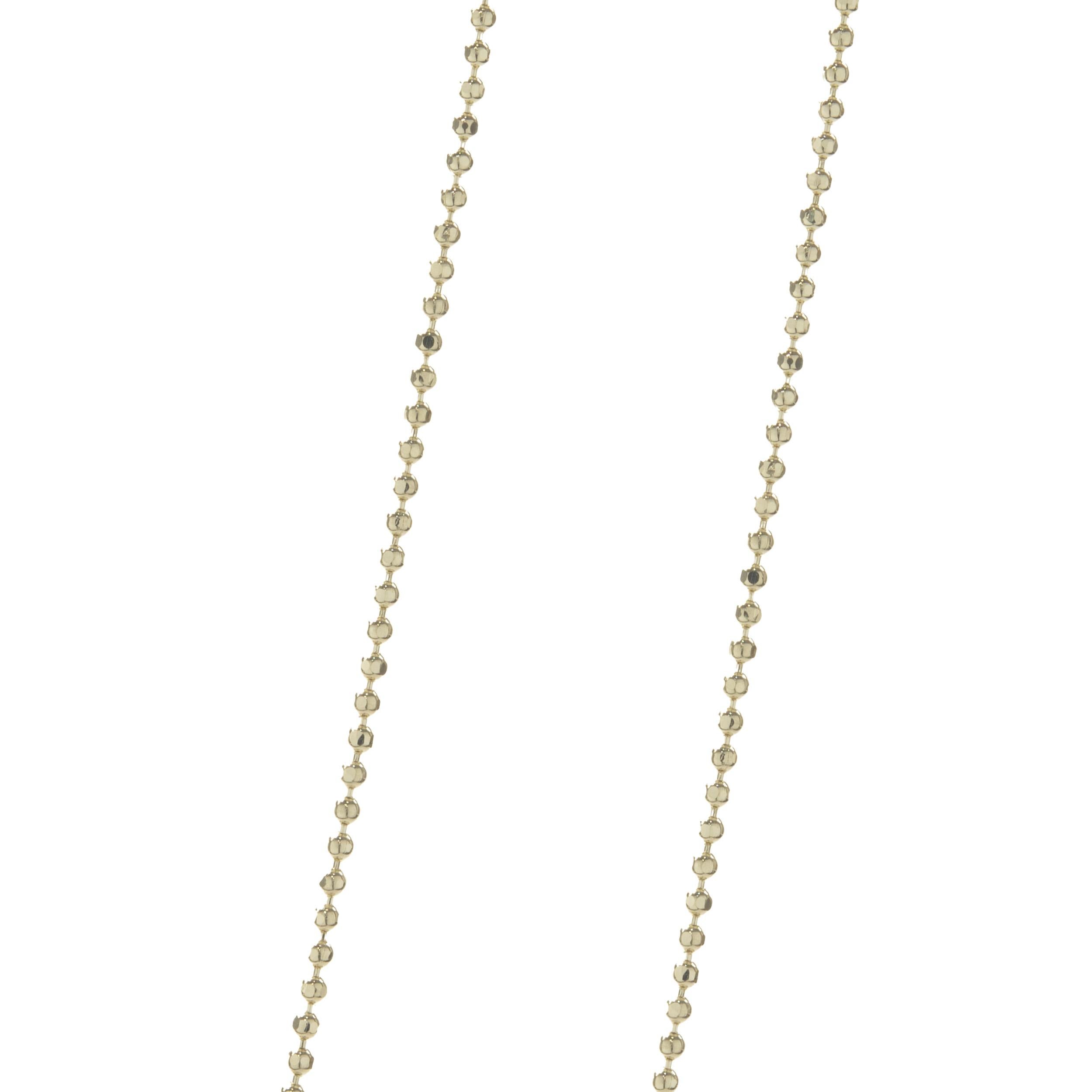 Round Cut 14 Karat Yellow Gold Diamond “S” Necklace For Sale