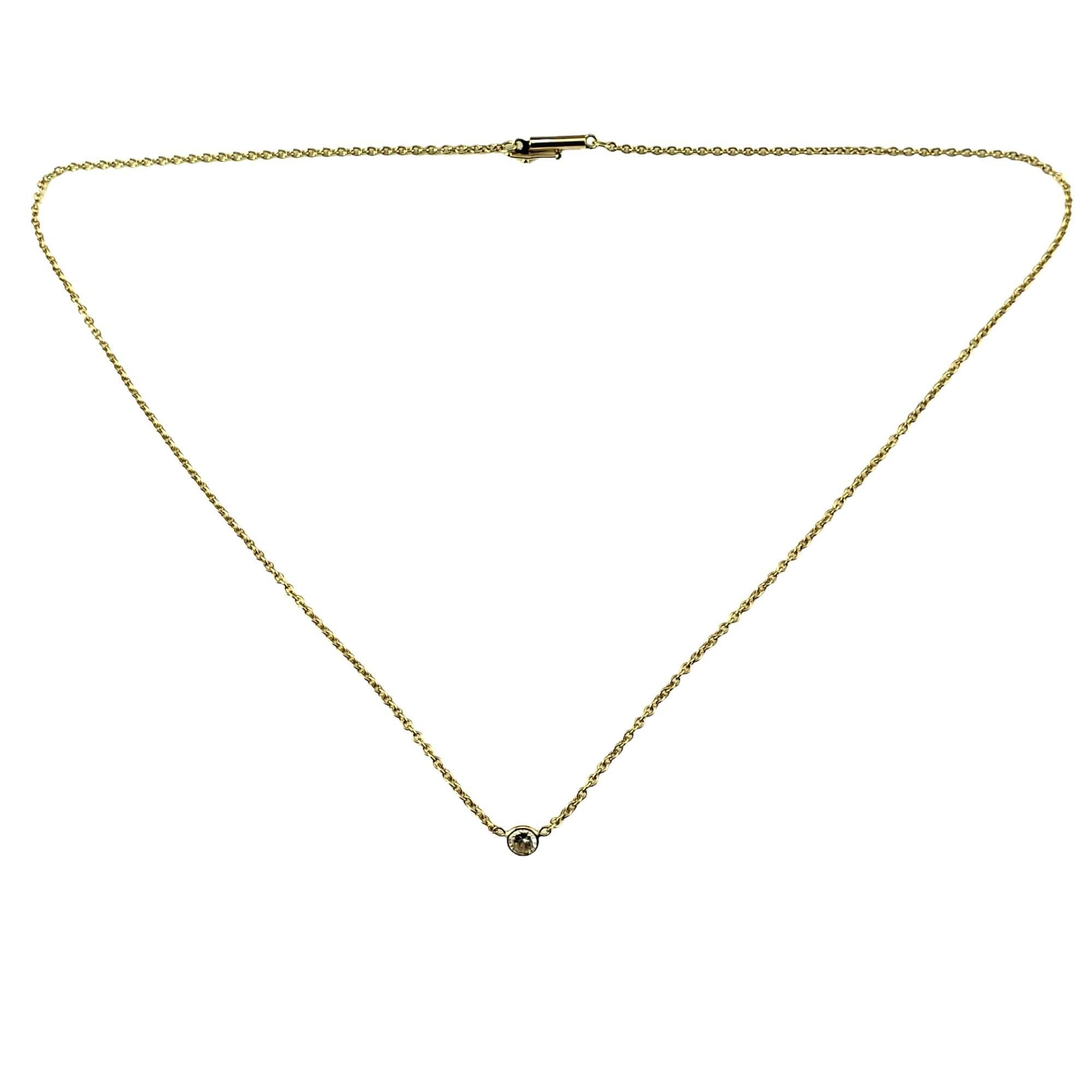 Vintage 14K Yellow Gold Diamond Solitaire Necklace-

This sparkling necklace features one round brilliant cut diamond bezel set on a classic 14K yellow gold necklace.

Approximate total diamond weight: .25 ct.

Diamond color: I

Diamond clarity: