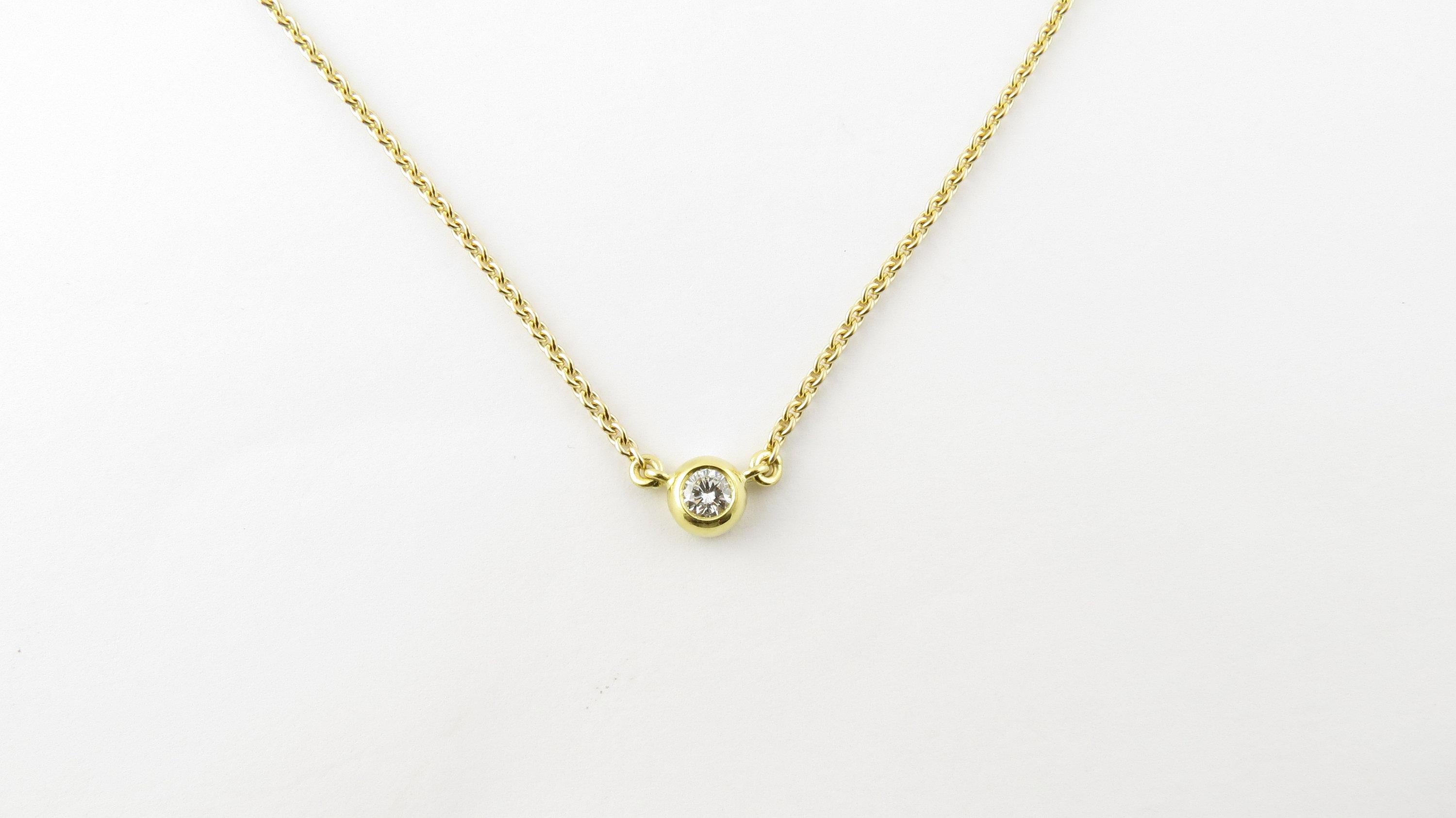 Vintage 14 Karat Yellow Gold Diamond Solitaire Necklace. This stunning necklace features one round brilliant cut diamond suspended in the center of a classic 14K yellow gold chain.
Approximate total diamond weight: .30 ct. Diamond color: F Diamond
