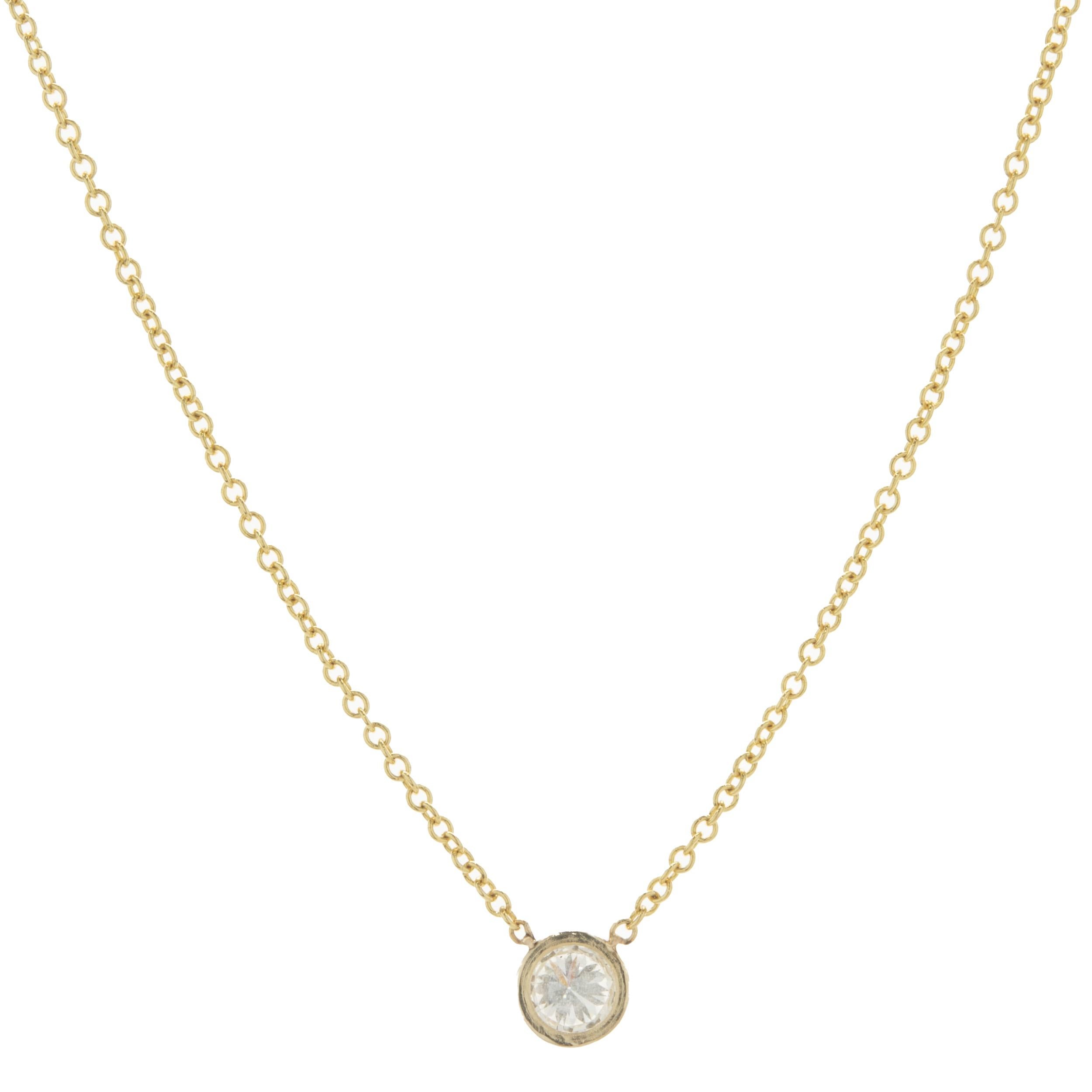 Designer: custom design
Material: 14K yellow gold
Diamond: 1 round brilliant cut = 0.17cttw
Color: G
Clarity: SI1
Dimensions: necklace measures 18-inches in length 
Weight: 1.34 grams