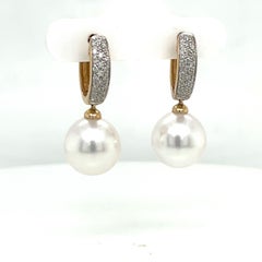 Orecchini a cerchio in oro giallo 14 carati con diamanti dei mari del sud 0,25 carati