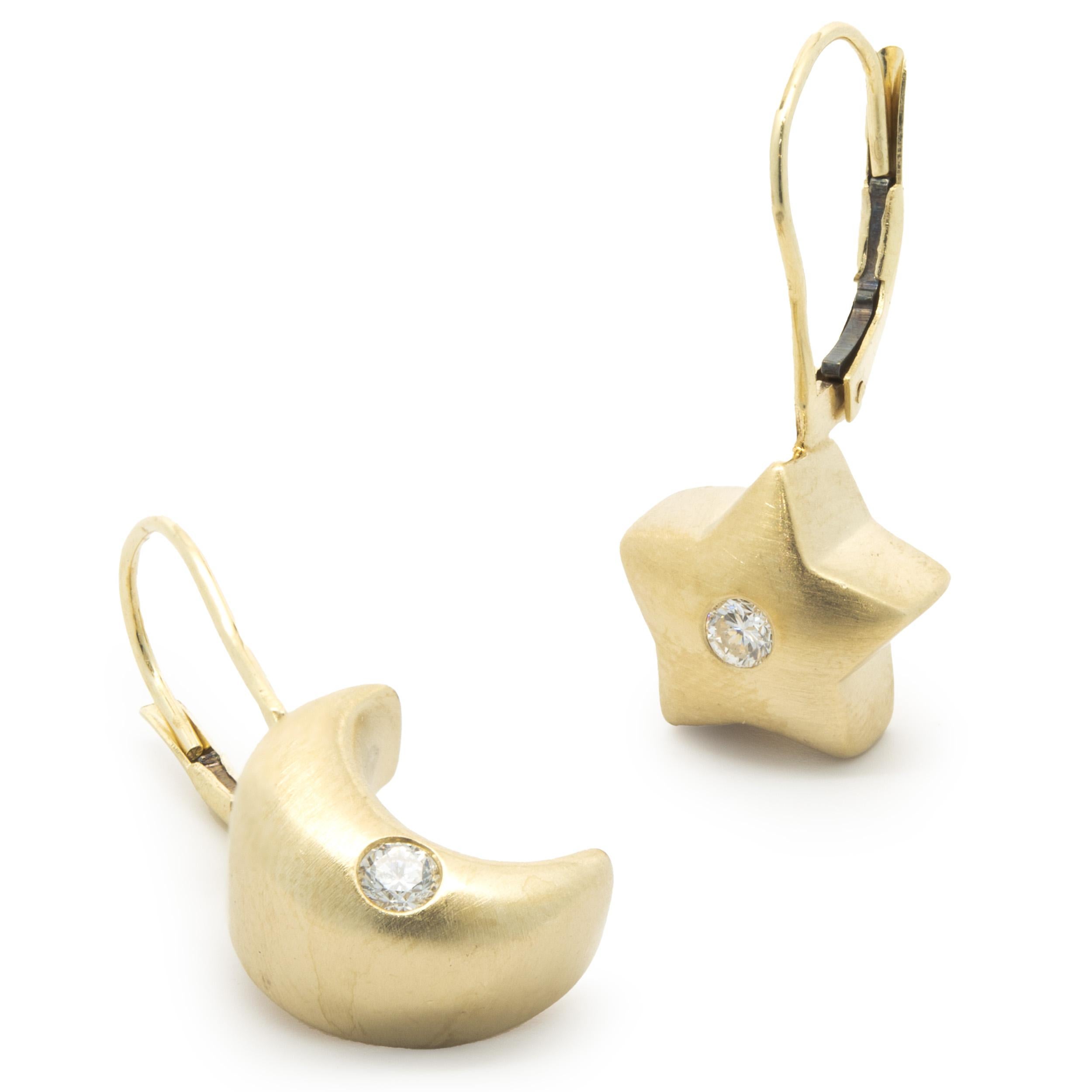 Designer: custom design
Material: 14K yellow gold
Diamond: 2 round brilliant cut = 0.12cttw
Color: H
Clarity: SI1
Dimensions: earrings measure 24mm long
Weight: 5.74 grams