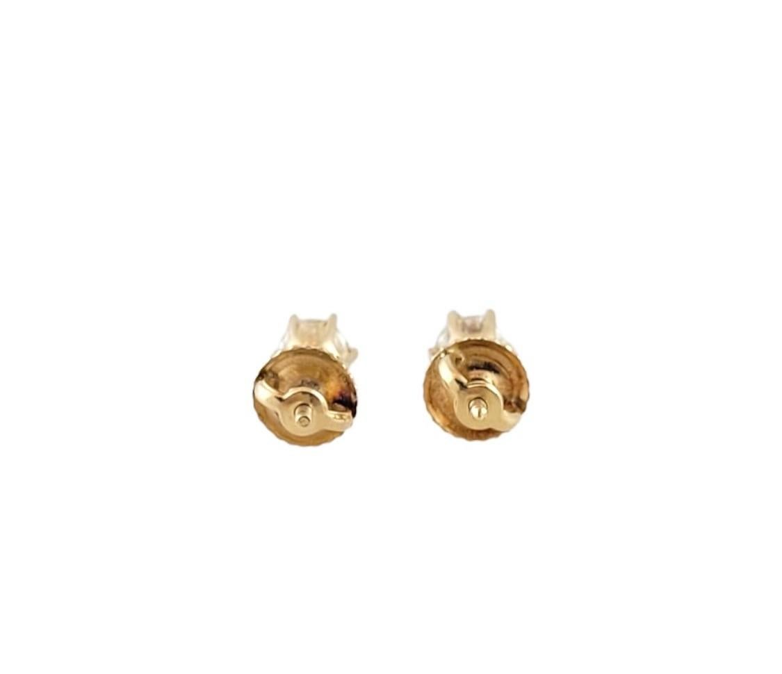 These sparkling earrings each feature one round brilliant cut diamond set in classic 14K yellow gold. Screw back closures.

Approximate total diamond weight: .62 ct.

Diamond color: K

Diamond clarity: SI1-K

Ring Size:  5 mm

Weight:  0.7 gr./  0.4