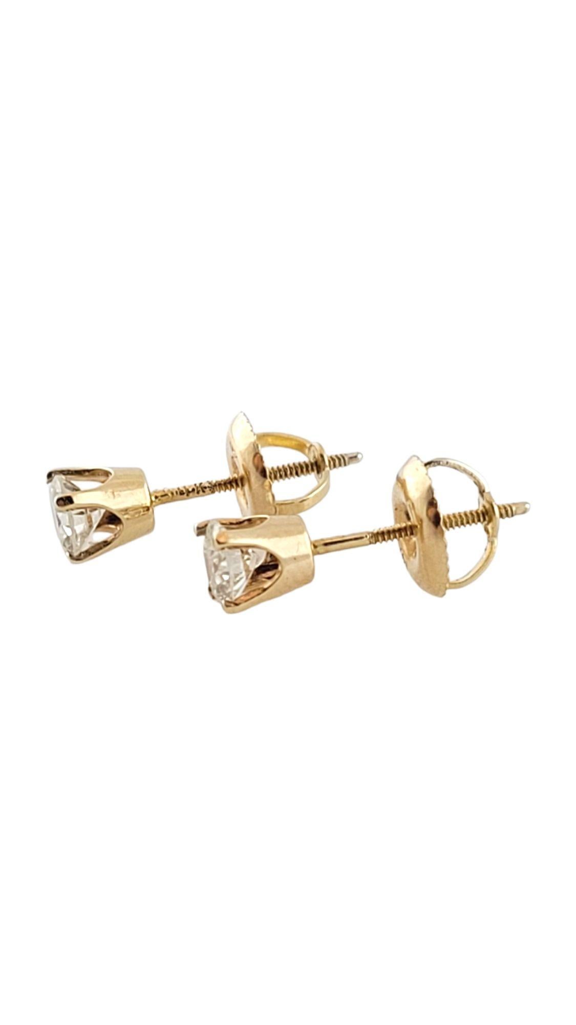 These sparkling stud earrings each feature one round brilliant cut diamond set in 14K yellow gold. Screw back closures.

Approximate total diamond weight: .48 ct.

Diamond color: J

Diamond clarity: I1-I2

Size:  4 mm

Weight:  0.8 gr./  0.5