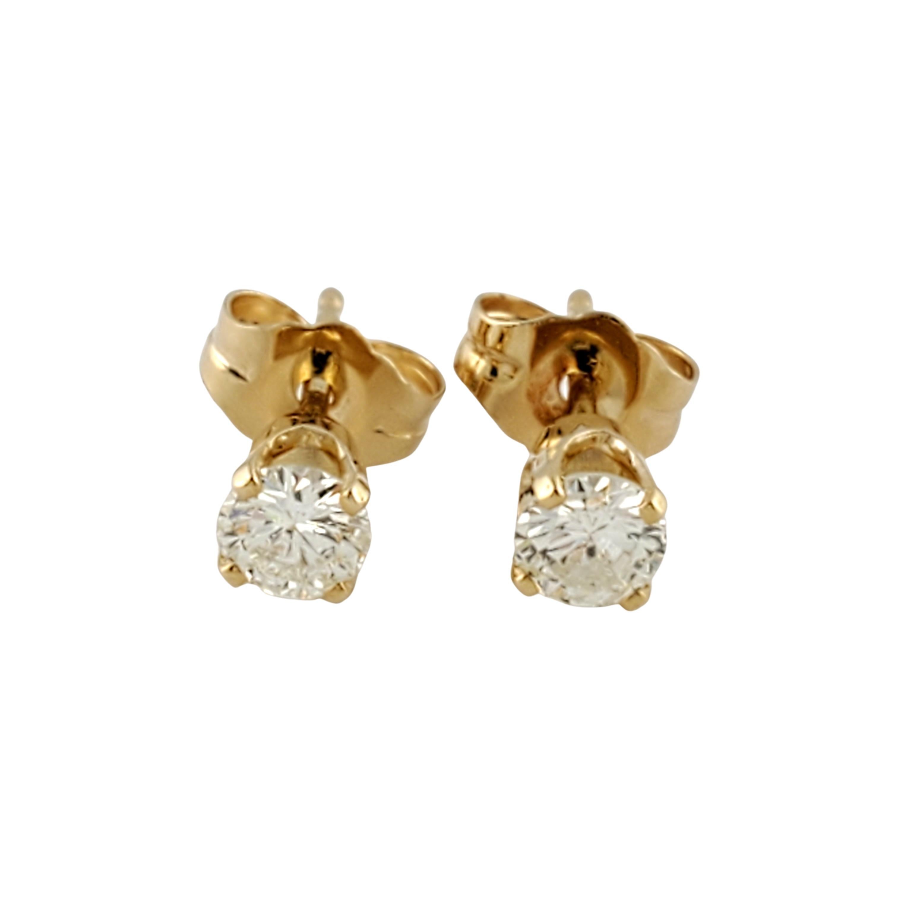 14 Karat Yellow Gold Diamond Stud Earrings .40 ct. twt.-

These sparkling earrings each feature one round brilliant cut diamond set in classic 14K yellow gold.  Push back closures.

Approximate total diamond weight:  .40 ct.

Diamond clarity: 