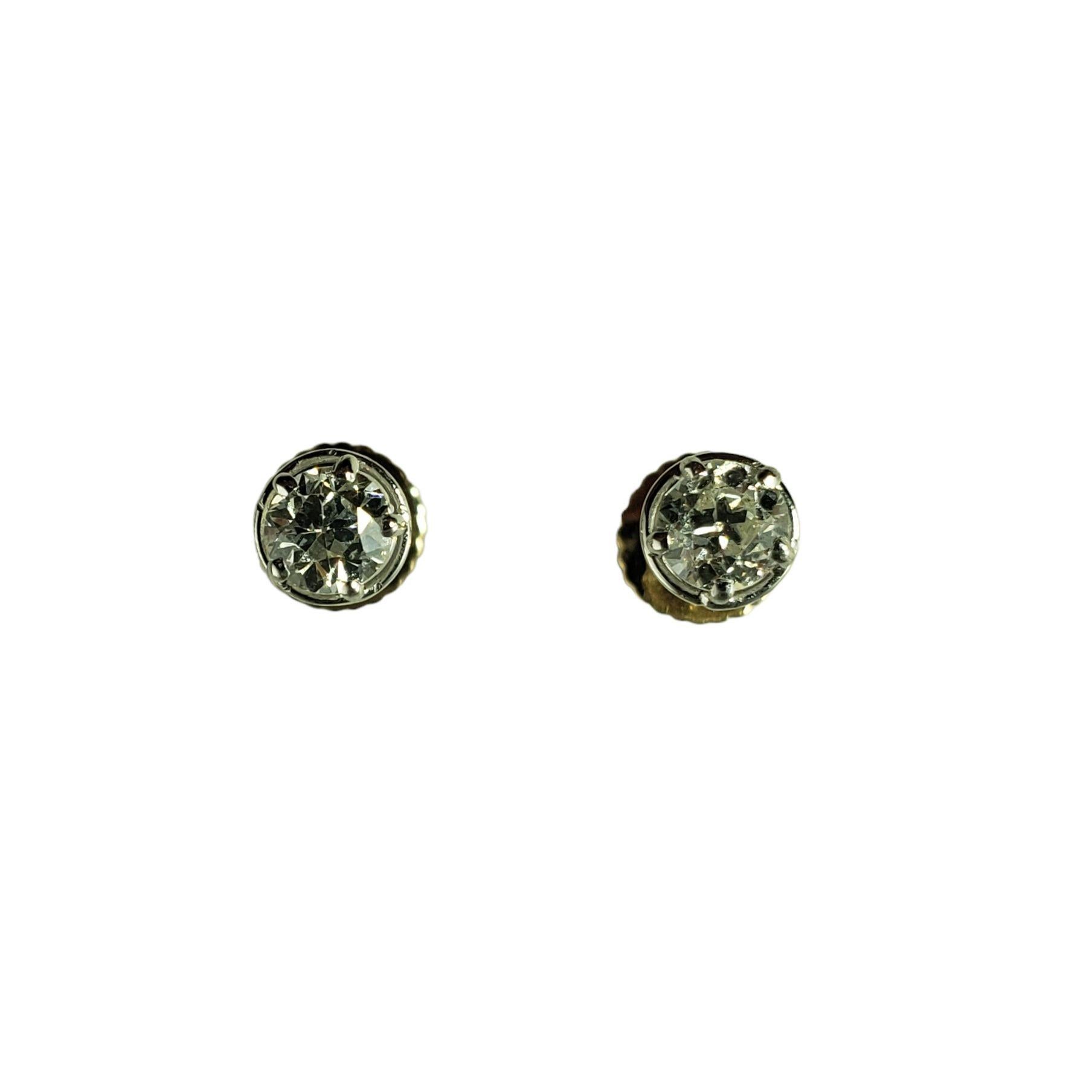 These sparkling stud earrings each feature one European cut diamond set in classic 14K yellow gold.  Screw back closures.

Approximate total diamond weight:  .40 ct.

Diamond color: K

Diamond clarity: SI1

Size: 5 mm

Weight:  1.0 gr./  0.6