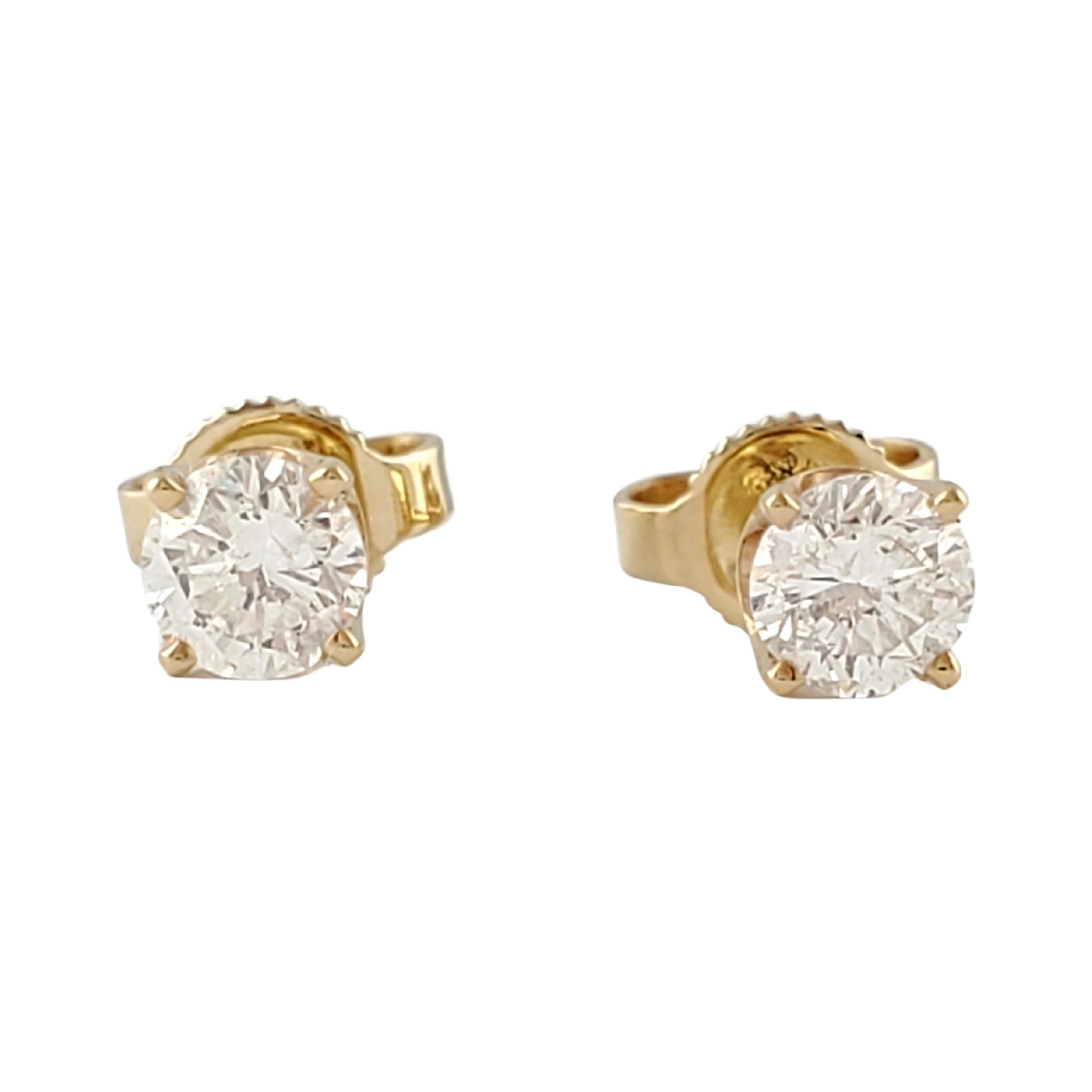 Vintage 14 Karat Yellow Gold Diamond Stud Earrings .60 ct.-

These sparkling stud earrings each feature one round brilliant cut diamond set in classic 14K yellow gold. Push back closures.

Approximate total diamond weight: .60 ct.

Diamond color: