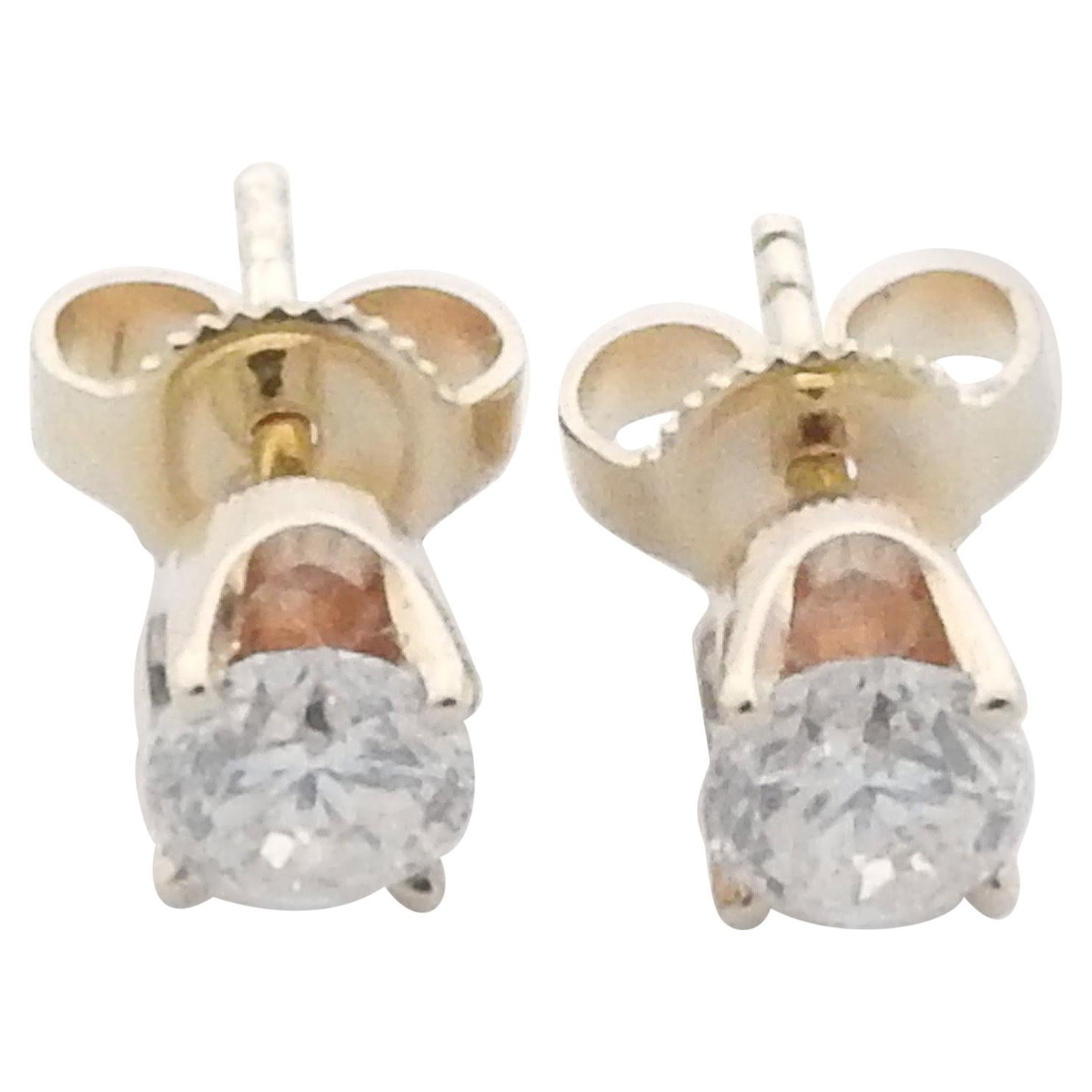 14 Karat Yellow Gold Diamond Stud Earrings .60 Carat For Sale