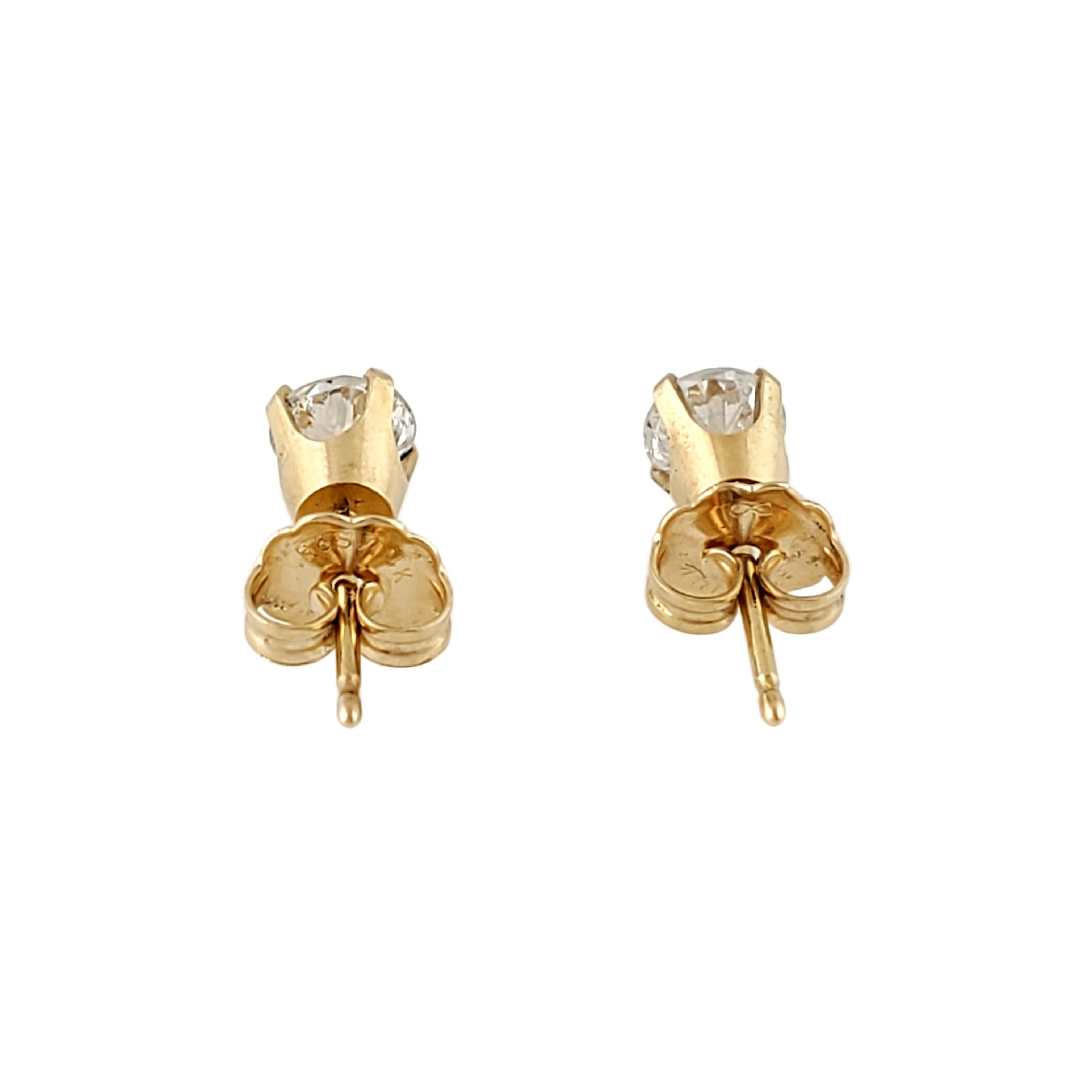 Round Cut 14 Karat Yellow Gold Diamond Stud Earrings .72 Carat For Sale