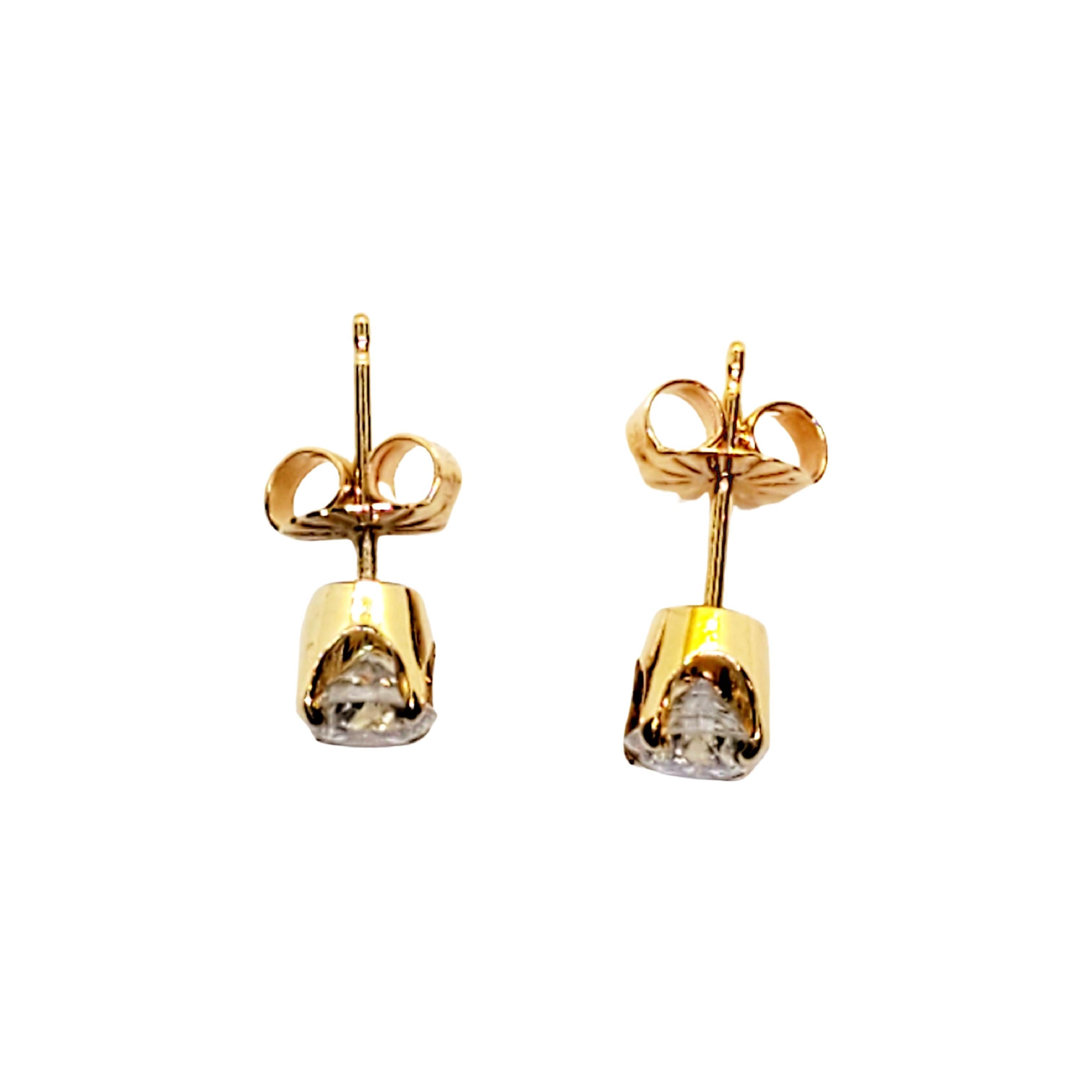 Round Cut 14 Karat Yellow Gold Diamond Stud Earrings .73 Carat For Sale